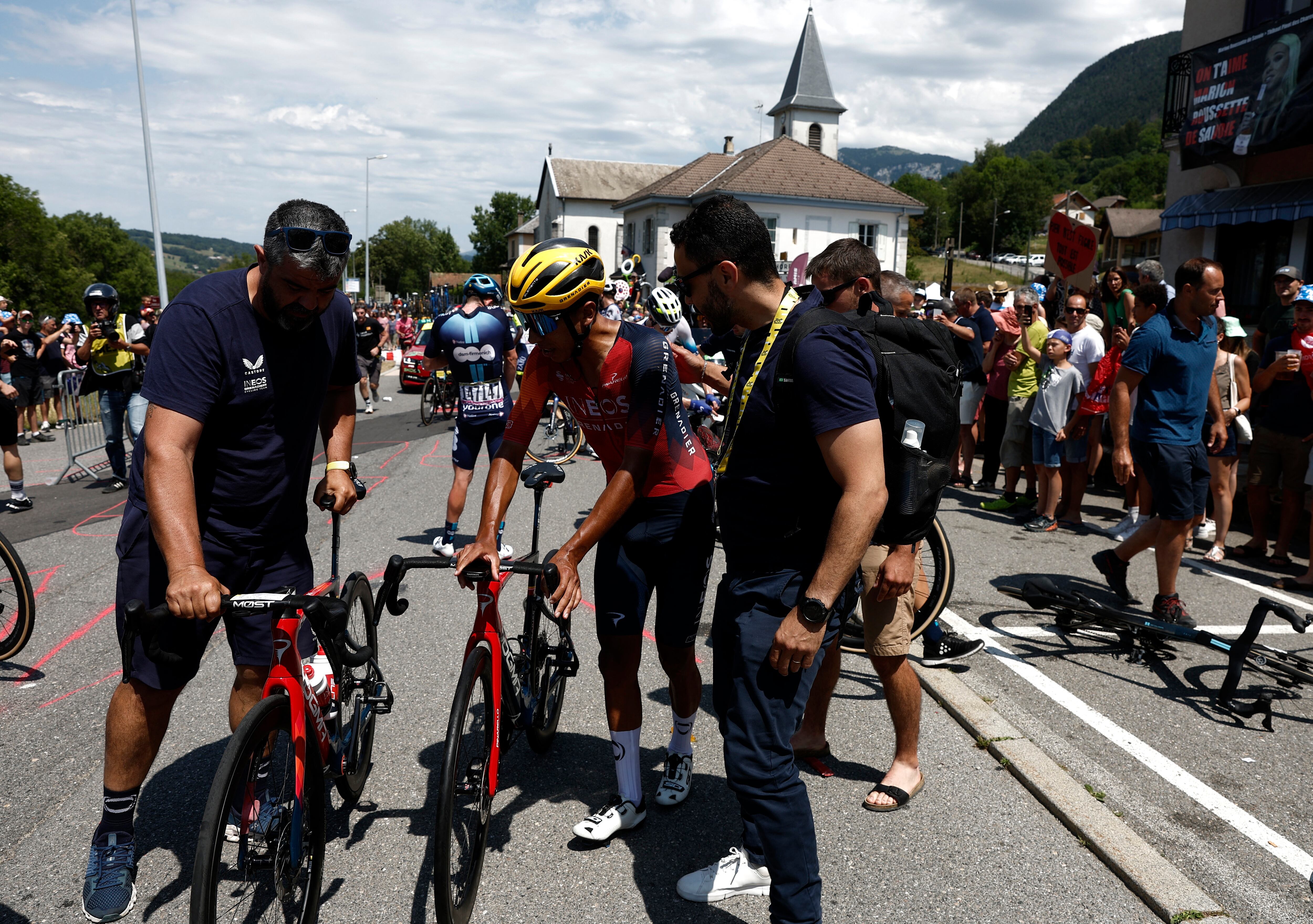 Cycling - Tour de France - Stage 15 - Les Gets Les Portes Du Soleil to Saint-Gervais Mont-Blanc - France - July 16, 2023 Ineos Grenadiers' Egan Bernal receives medical attention after a crash during stage 15 REUTERS/Benoit Tessier