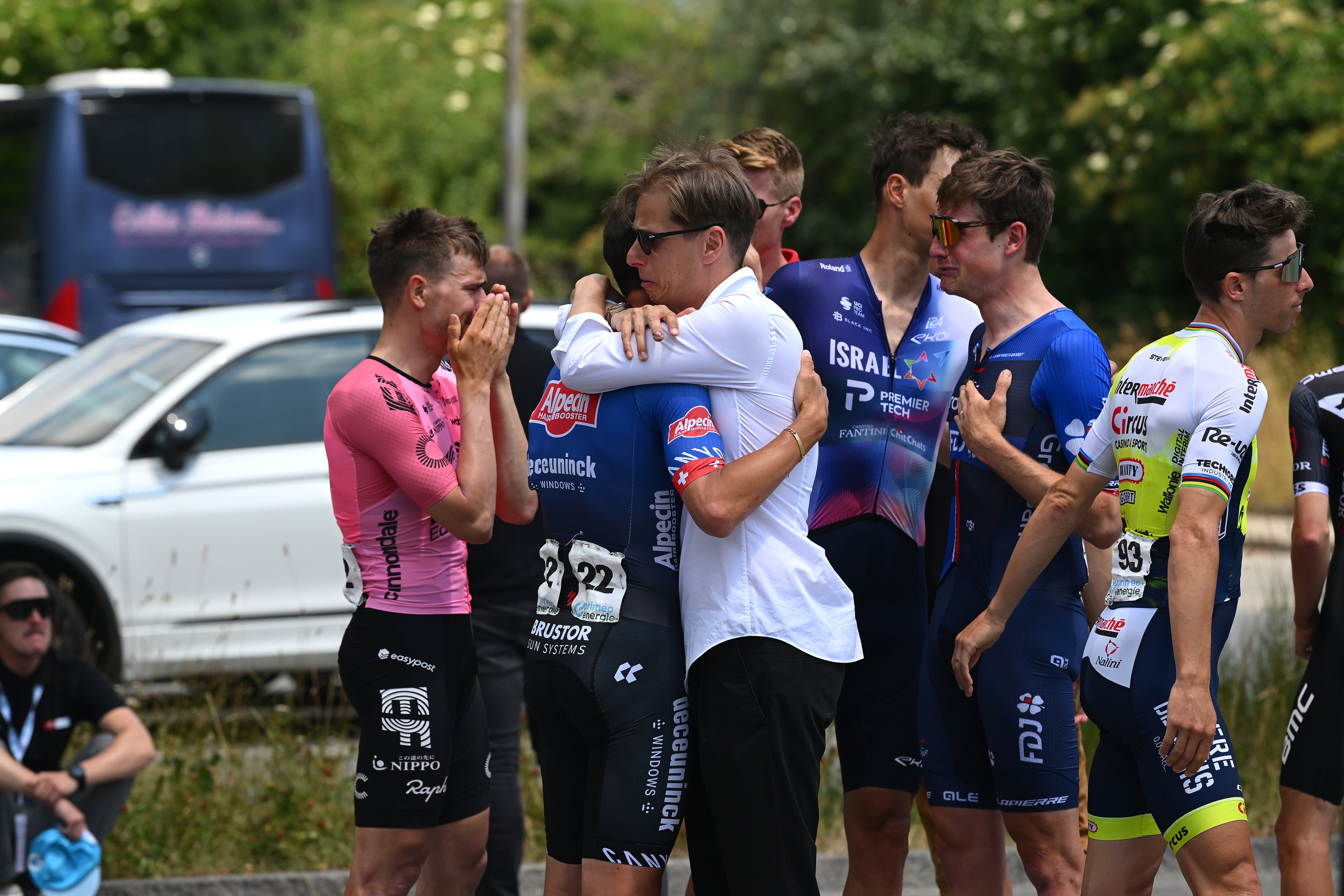 CHUR, SWITZERLAND - JUNE 16: (L-R) Stefan Bissegger of Switzerland and Team EF Education-EasyPost, Silvan Dillier of Switzerland and Team Alpecin-Deceuninck, Stefan Küng of Switzerland and Team Groupama-FDJ and Team Bahrain Victorious staff shocked by the death of Gino Mäder of Switzerland and Team Bahrain Victorious after the fall suffered in yesterday's stage prior to the 86th Tour de Suisse 2023, Stage 6 a 140.9km stage from Chur to Oberwil-Lieli 565m / Stage route modificated regarding rock avalanche in Brienz / #UCIWT / on June 16, 2023 in Chur, Switzerland. (Photo by Dario Belingheri/Getty Images)