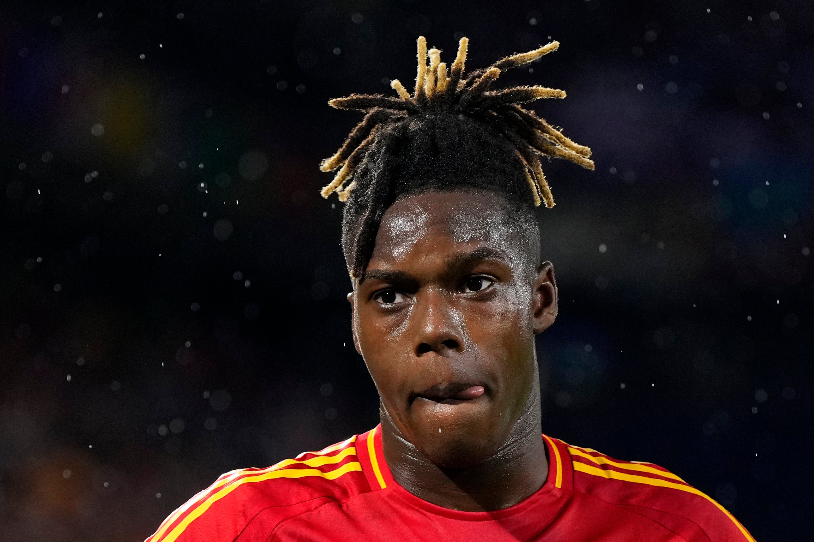 Spain's Nico Williams walks on pitch during a round of sixteen match between Spain and Georgia at the Euro 2024 soccer tournament in Cologne, Germany, Sunday, June 30, 2024. (AP Photo/Manu Fernandez)
