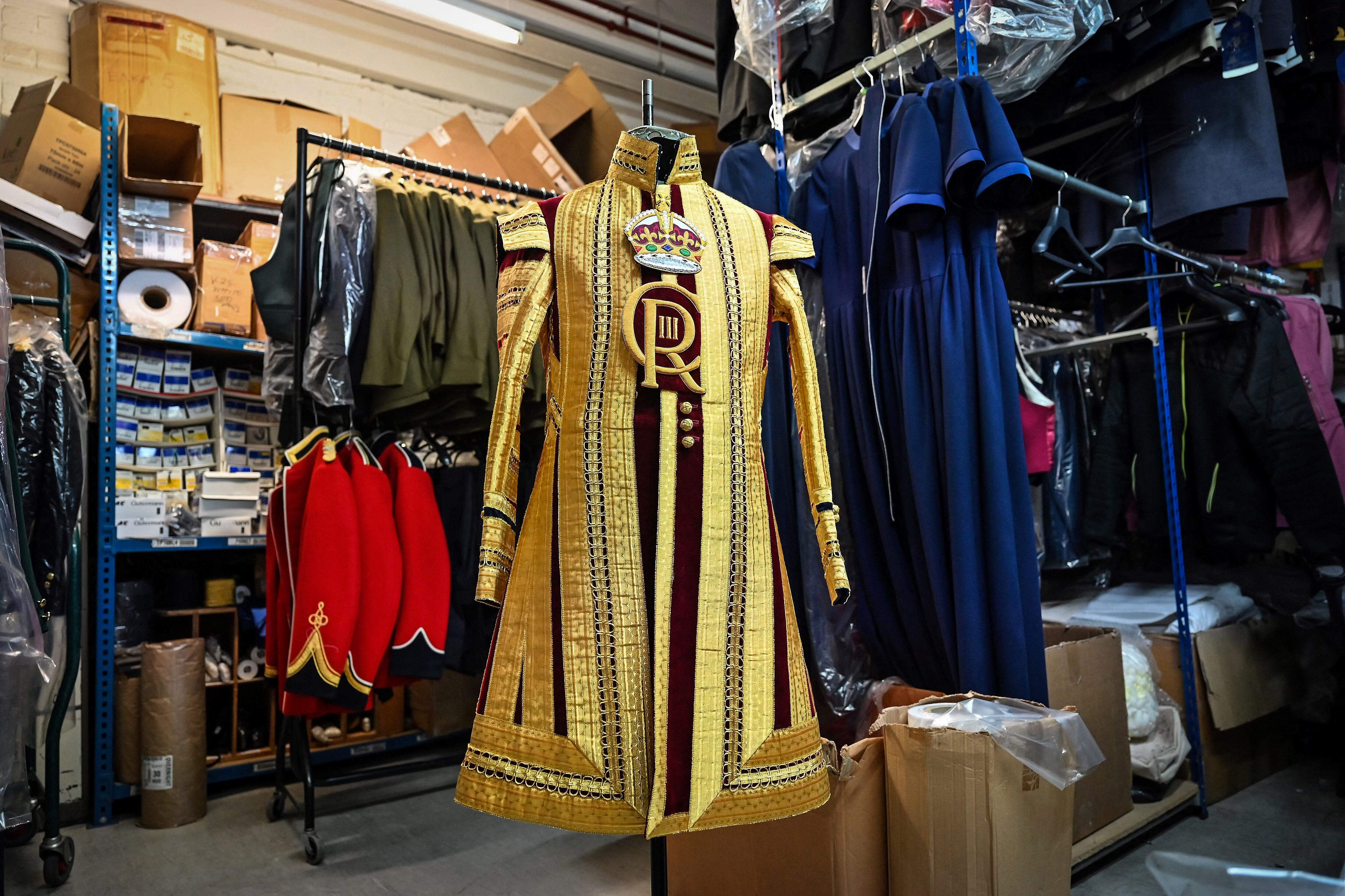 A Drum Major's State coat adorned with the new CR III cypher and to be worn during the Coronation of Britain's King Charles III and his wife Britain's Camilla, Queen Consort is pictured at Kashket & Partners atelier, in north London, on May 5, 2023. (Photo by Justin TALLIS / AFP)