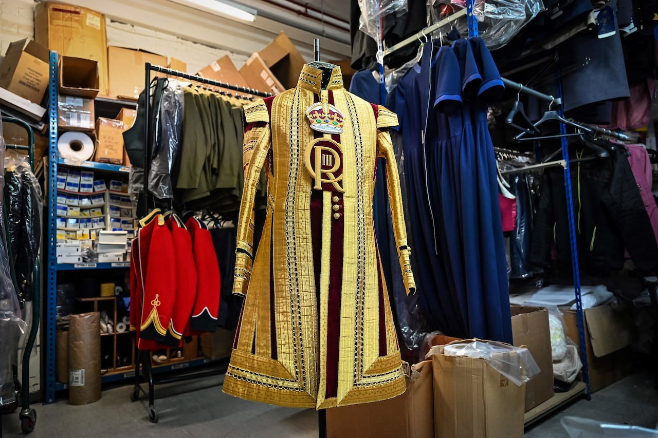 A Drum Major's State coat adorned with the new CR III cypher and to be worn during the Coronation of Britain's King Charles III and his wife Britain's Camilla, Queen Consort is pictured at Kashket & Partners atelier, in north London, on May 5, 2023. (Photo by Justin TALLIS / AFP)