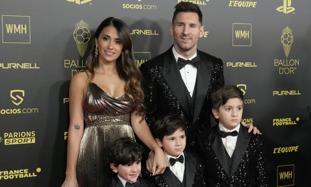PSG player Lionel Messi, his wife Antonela Roccuzzo and their sons Thiago, Matteo and Ciro arrive for the 65th Ballon d'Or ceremony at Theatre du Chatelet, in Paris, Monday, Nov. 29, 2021. (AP Photo/Christophe Ena)