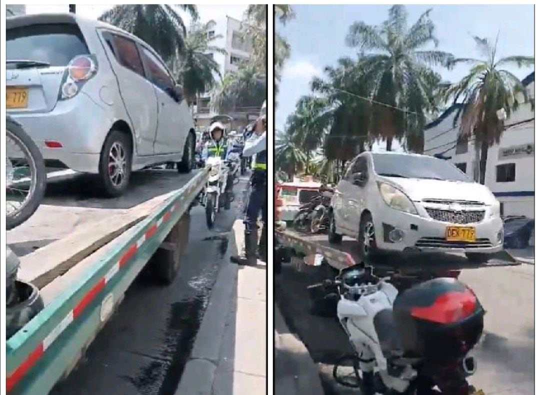 Así quedó captado el momento en que un hombre conductor de un automóvil particular en la capital del Valle le suplica desesperadamente al conductor de una grúa y a un agente de tránsito que no se lleven su vehículo a los patios.