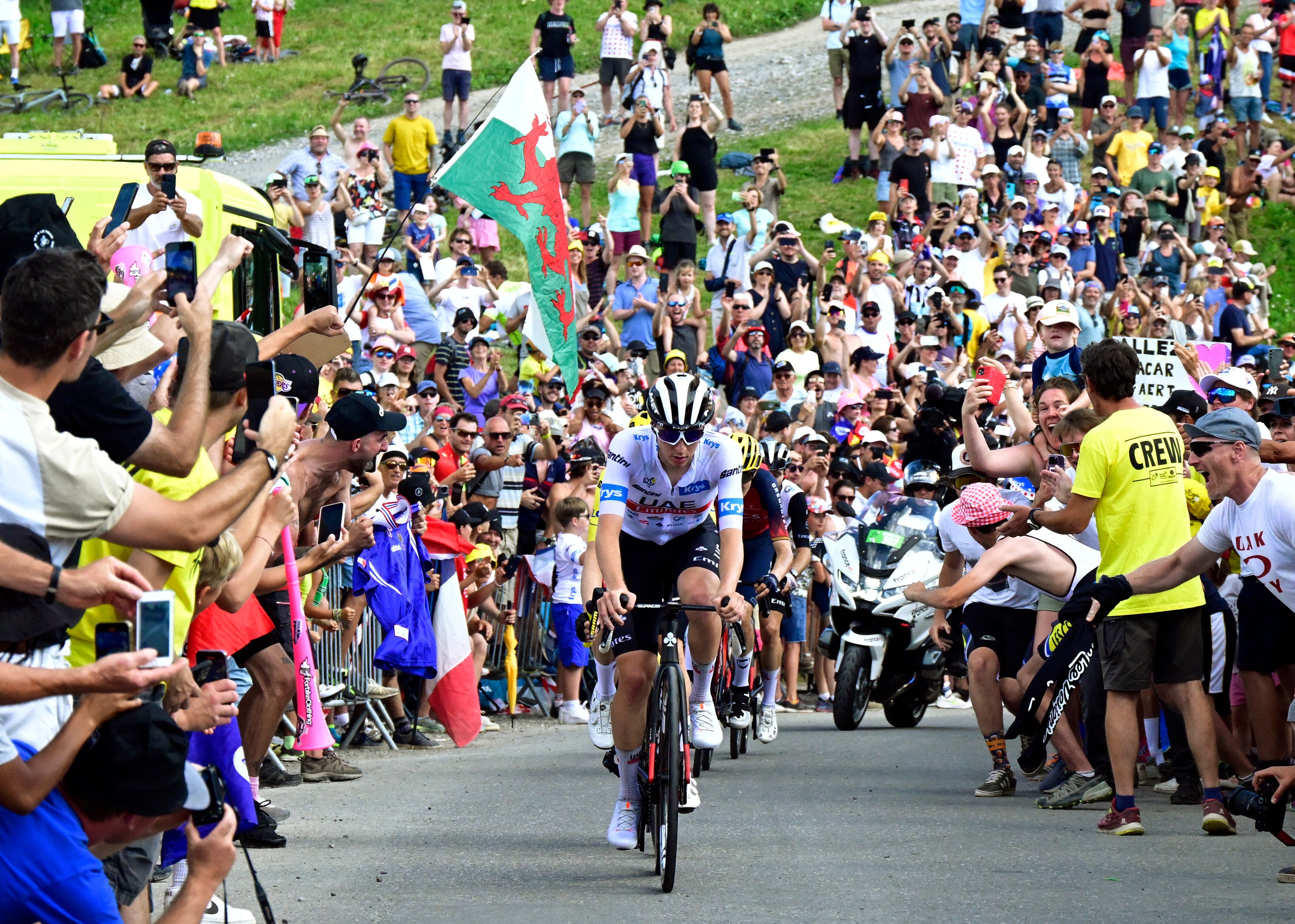 Cycling - Tour de France - Stage 14 - Annemasse to Morzine Les Portes Du Soleil - France - July 15, 2023 UAE Team Emirates' Tadej Pogacar in action during stage 14 as spectators cheer on Pool via REUTERS/Papon Bernard