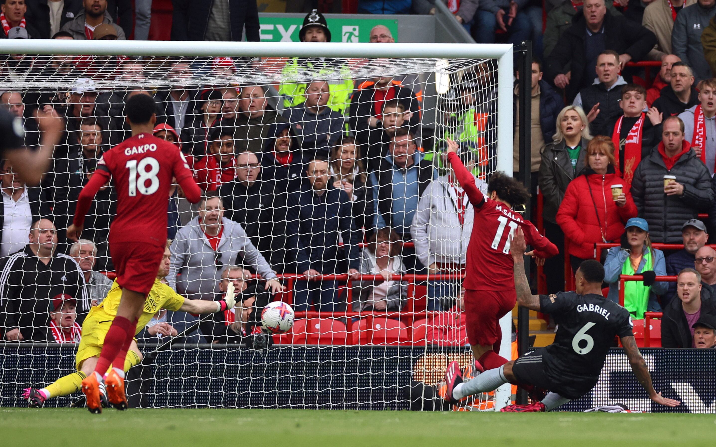Soccer Football - Premier League - Liverpool v Arsenal - Anfield, Liverpool, Britain - April 9, 2023 Liverpool's Mohamed Salah scores their first goal REUTERS/Phil Noble EDITORIAL USE ONLY. No use with unauthorized audio, video, data, fixture lists, club/league logos or 'live' services. Online in-match use limited to 75 images, no video emulation. No use in betting, games or single club /league/player publications.  Please contact your account representative for further details.