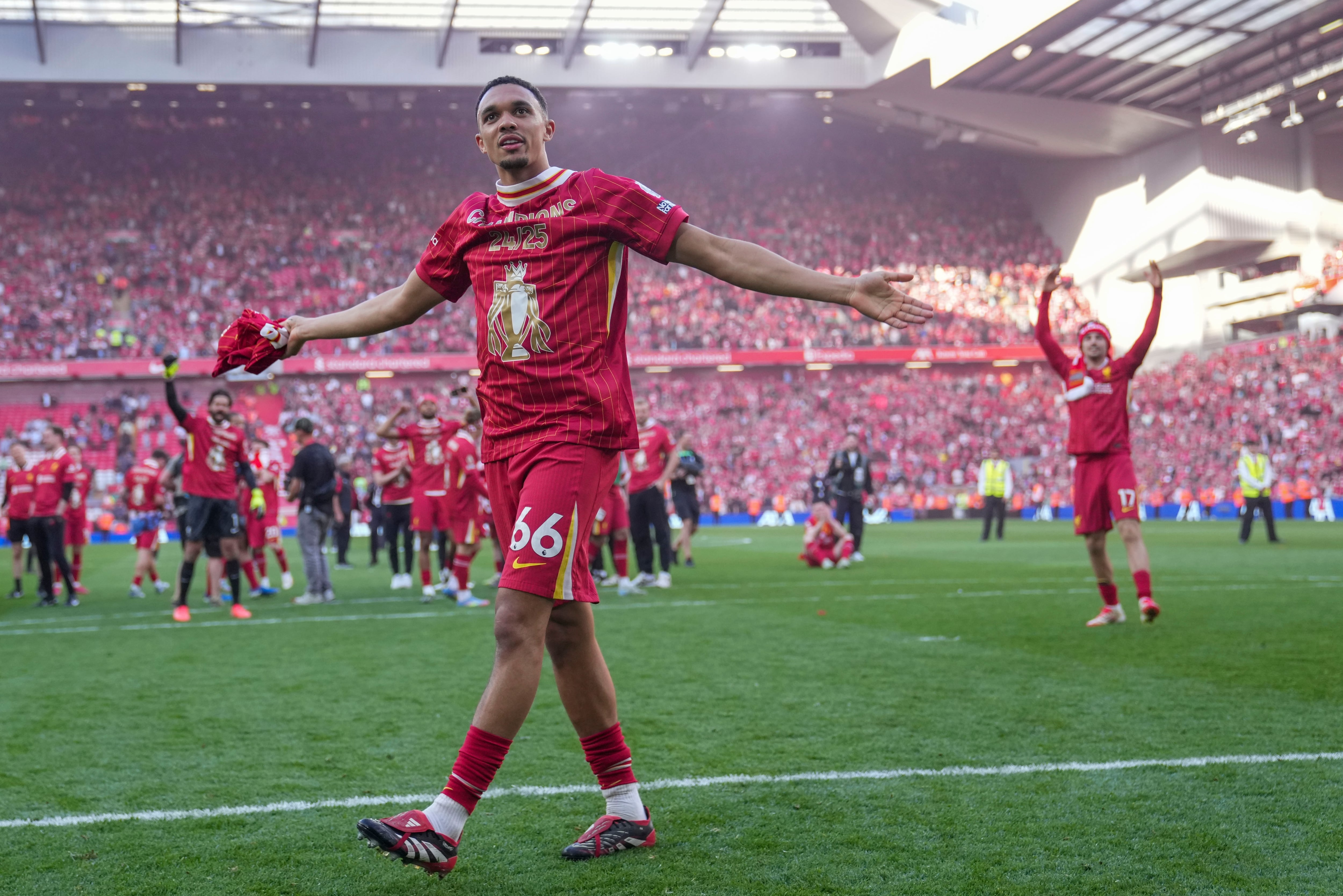 Liverpool's Trent Alexander-Arnold celebrates after winning the English Premier League soccer match between Liverpool and Tottenham Hotspur and clinching the Premier League title at Anfield in Liverpool, England, Sunday, April 27, 2025. (AP Photo/Jon Super)