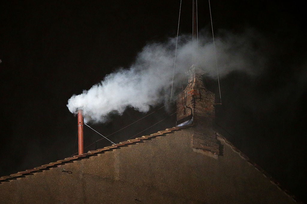 VATICAN CITY, VATICAN - MARCH 13:  White smoke billows from the chimney on the roof of the Sistine Chapel indicating that the College of Cardinals have elected a new Pope on March 13, 2013 in Vatican City, Vatican. Pope Benedict XVI's successor - the 266th Pontiff - has been selected by the College of Cardinals in Conclave in the Sistine Chapel.  (Photo by Peter Macdiarmid/Getty Images)