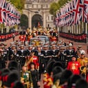 The coffin of Queen Elizabeth II is carried following her funeral service in Westminster Abbey in central London, Monday, Sept. 19, 2022. The Queen, who died aged 96 on Sept. 8, will be buried at Windsor alongside her late husband, Prince Philip, who died last year. (AP Photo/Vadim Ghirda, Pool)