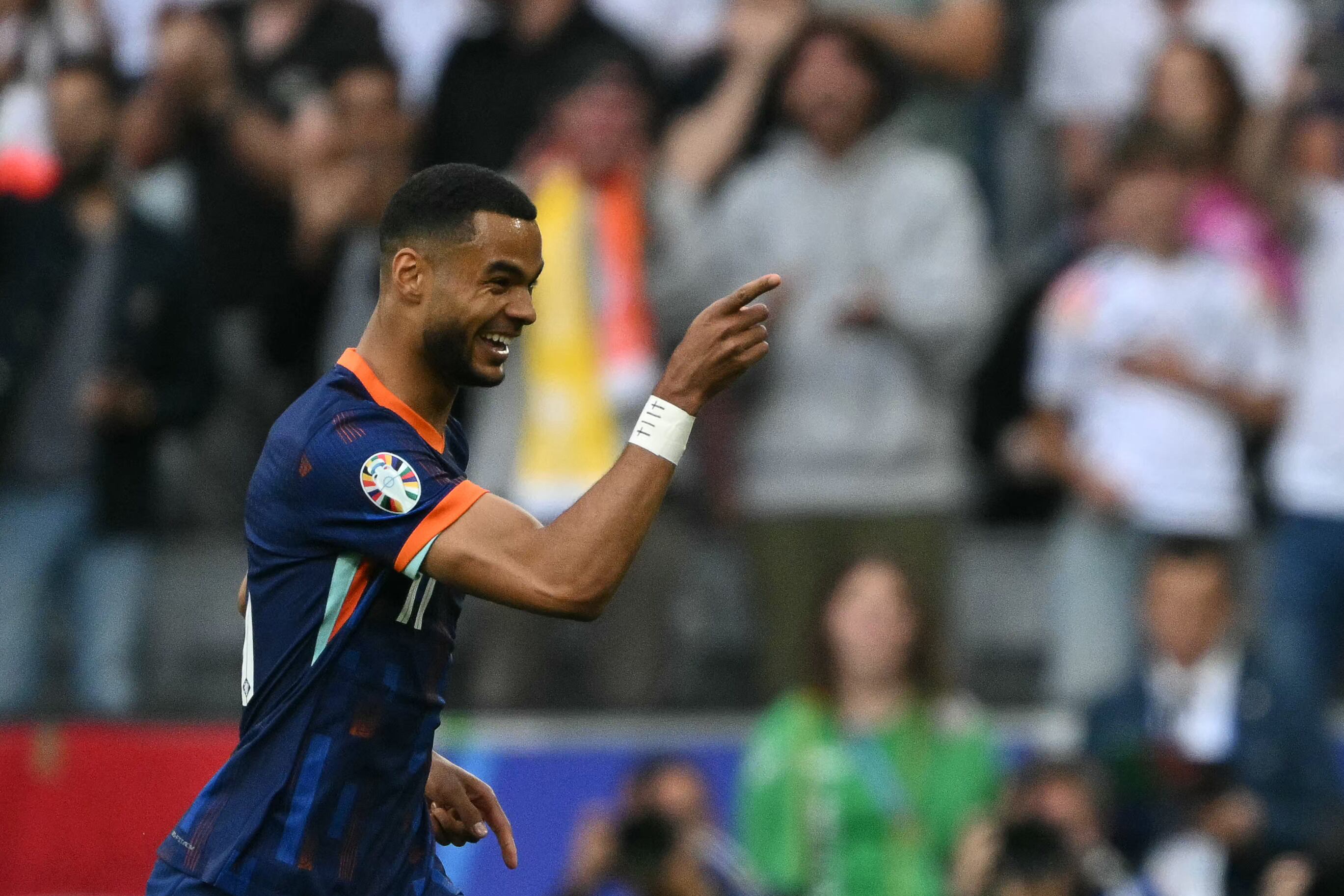 Netherlands' forward #11 Cody Gakpo celebrates scoring his team's first goal during the UEFA Euro 2024 round of 16 football match between Romania and the Netherlands at the Munich Football Arena in Munich on July 2, 2024. (Photo by MIGUEL MEDINA / AFP)