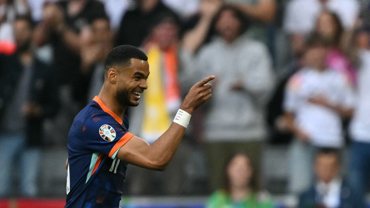 Netherlands' forward #11 Cody Gakpo celebrates scoring his team's first goal during the UEFA Euro 2024 round of 16 football match between Romania and the Netherlands at the Munich Football Arena in Munich on July 2, 2024. (Photo by MIGUEL MEDINA / AFP)