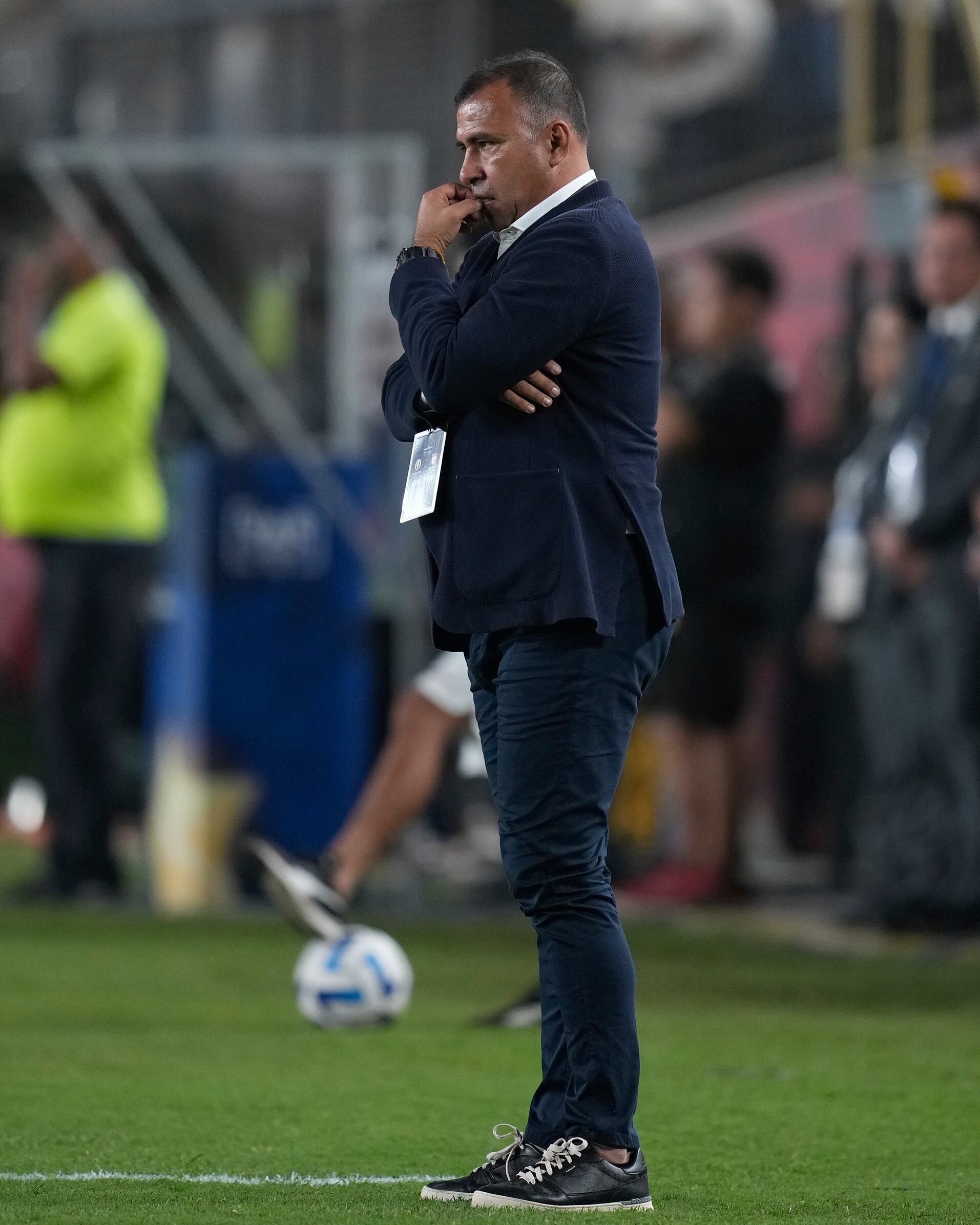 Coach Harold Rivera of Colombia's Independiente Santa Fe, stands on the sideline during a Copa Sudamericana group G soccer match against Peru's Universitario at Monumental stadium in Lima, Peru, Thursday, May 4, 2023. (AP Photo/Martin Mejia)