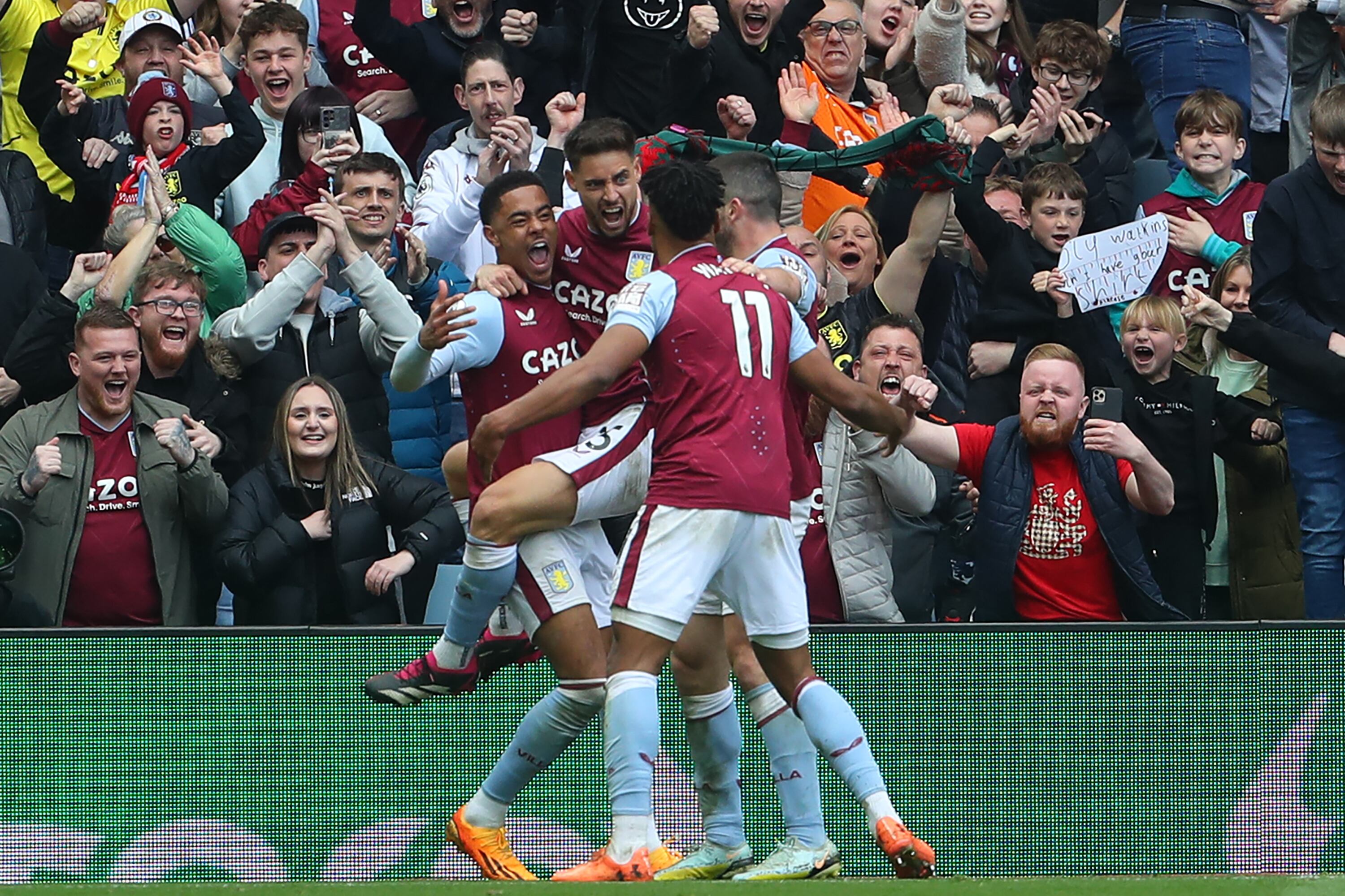 Aston Villa's English striker Ollie Watkins (C) celebrates with teammates after scoring their second goal during the English Premier League football match between Aston Villa and Newcastle Utd at Villa Park in Birmingham, central England on April 15, 2023. (Photo by Geoff Caddick / AFP) / RESTRICTED TO EDITORIAL USE. No use with unauthorized audio, video, data, fixture lists, club/league logos or 'live' services. Online in-match use limited to 120 images. An additional 40 images may be used in extra time. No video emulation. Social media in-match use limited to 120 images. An additional 40 images may be used in extra time. No use in betting publications, games or single club/league/player publications. /