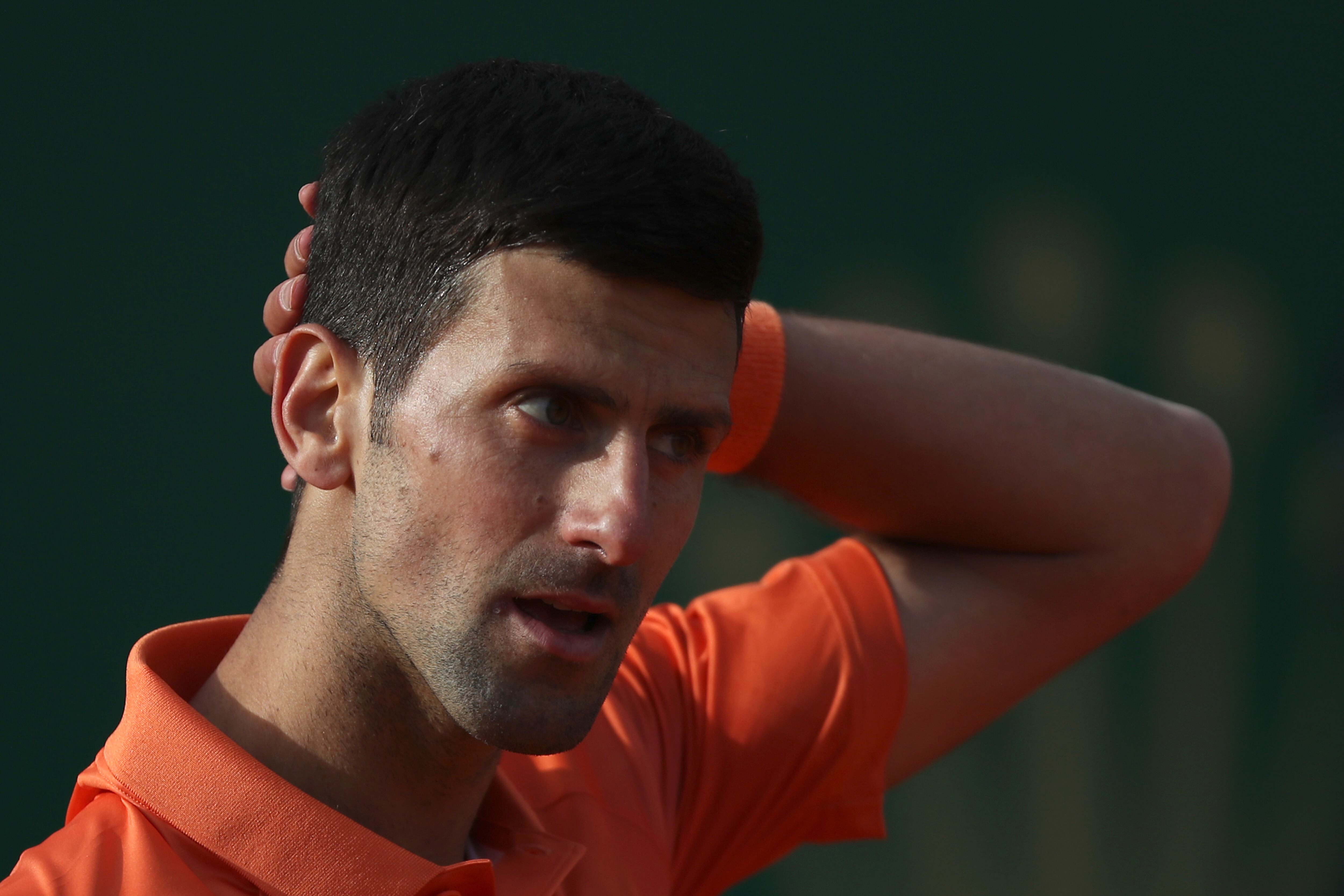 Serbia's Novak Djokovic reacts as he plays Spain's Alejandro Davidovich Fokina during their second round match at the Monte-Carlo Masters tennis tournament, Tuesday, April 12, 2022 in Monaco. (AP Photo/Daniel Cole)
