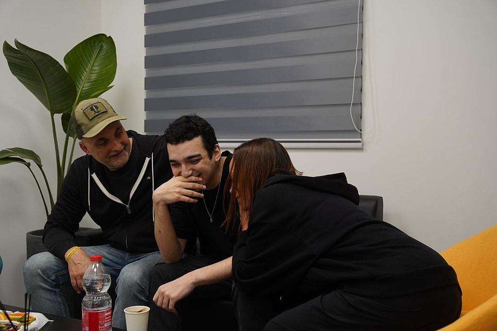 TEL AVIV, ISRAEL - MAY 12: (----EDITORIAL USE ONLY  MANDATORY CREDIT - 'ISRAEL DEFENSE FORCES (IDF) / HANDOUT' - NO MARKETING NO ADVERTISING CAMPAIGNS - DISTRIBUTED AS A SERVICE TO CLIENTS----) A screen grab from a video released by Israel Defense Forces (IDF) shows American-Israeli hostage Edan Alexander reuniting his family after Palestinian resistance group Hamas released him in Tel Aviv, Israel on May 12, 2025. (Photo by Israeli Defense Forces / IDF / Handout/Anadolu via Getty Images)