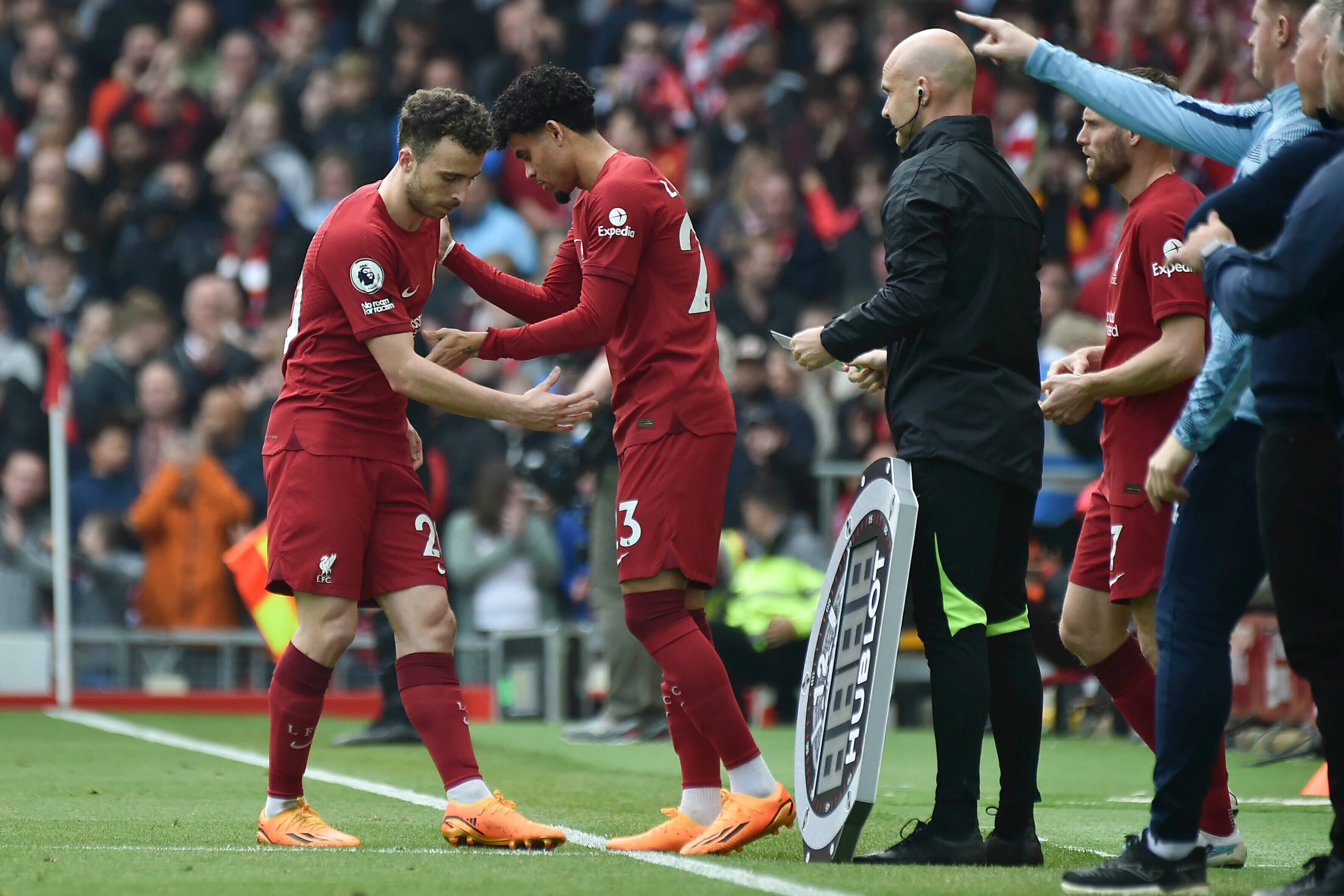 Liverpool's Diogo Jota, left, is substituted by Liverpool's Luis Diaz during the Premier League soccer match between Liverpool and Nottingham Forest at Anfield, in Liverpool, England, Saturday April 22, 2023. (AP Photo/Rui Vieira)