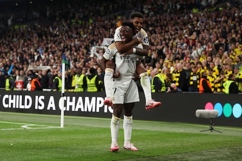 LONDON, ENGLAND - JUNE 01: Vinicius Junior of Real Madrid celebrates scoring his team's second goal with teammate Rodrygo during the UEFA Champions League 2023/24 Final match between Borussia Dortmund and Real Madrid CF at Wembley Stadium on June 01, 2024 in London, England. (Photo by Lars Baron/Getty Images)