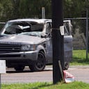Emergency personnel take away a damaged vehicle after a fatal collision in Brownsville, Texas, Sunday, May 7, 2023. Several migrants were killed after they were struck by a vehicle while waiting at a bus stop near Ozanam Center, a migrant and homeless shelter. (AP Photo/Michael Gonzalez)