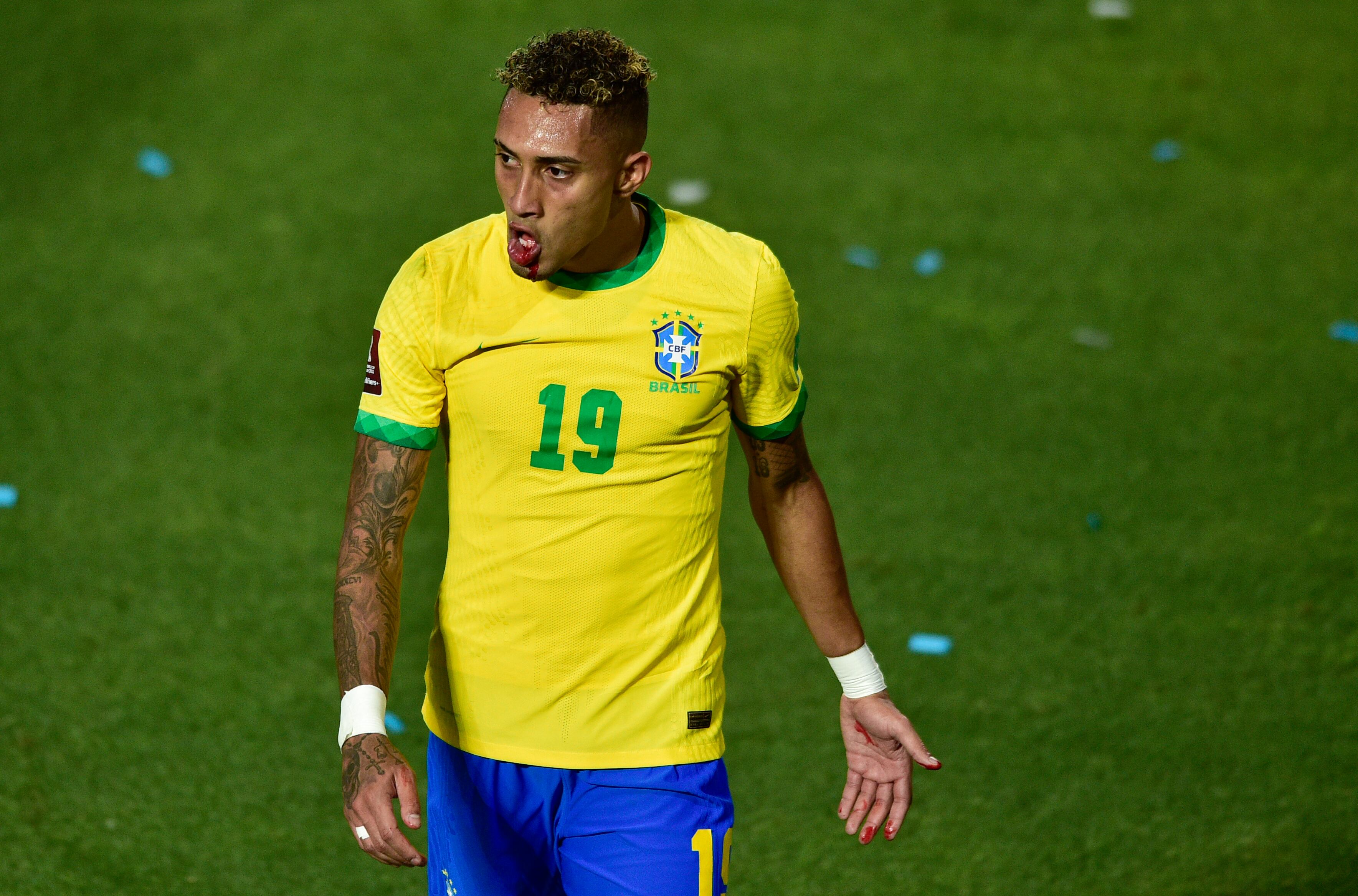 Brazil's Raphinha mouth bleeds after a knock during a qualifying soccer match against Argentina for the FIFA World Cup Qatar 2022 at Bicentenario stadium in San Juan, Argentina, Tuesday, Nov. 16, 2021. (AP Photo/Gustavo Garello)