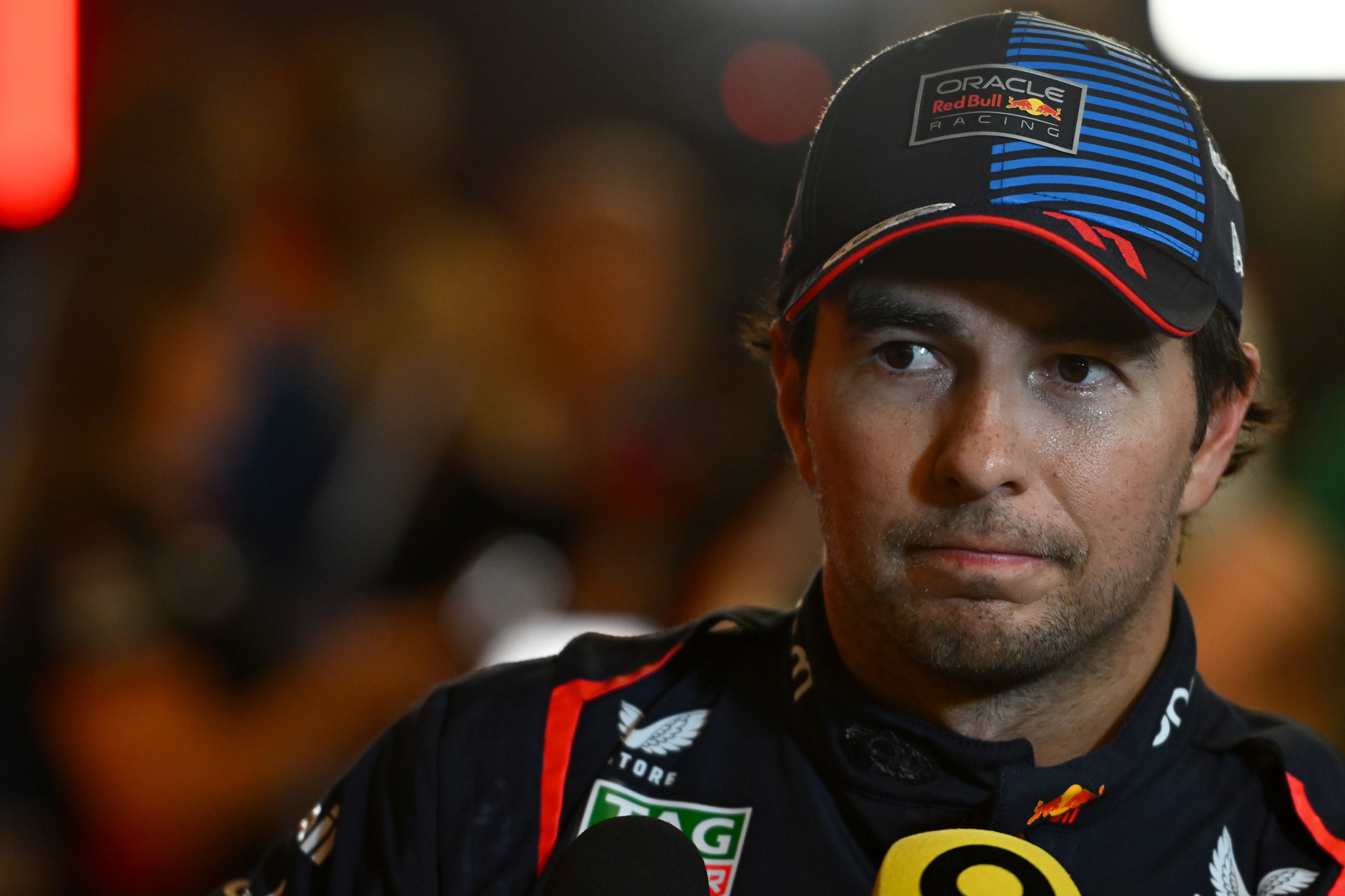 ABU DHABI, UNITED ARAB EMIRATES - DECEMBER 07: 10th placed qualifier Sergio Perez of Mexico and Oracle Red Bull Racing talks to the media in the Paddock after qualifying ahead of the F1 Grand Prix of Abu Dhabi at Yas Marina Circuit on December 07, 2024 in Abu Dhabi, United Arab Emirates. (Photo by Rudy Carezzevoli/Getty Images)