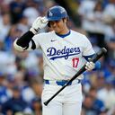 Los Angeles Dodgers' Shohei Ohtani bats against the New York Mets during the first inning in Game 6 of a baseball NL Championship Series, Sunday, Oct. 20, 2024, in Los Angeles. (AP Photo/Julio Cortez)
