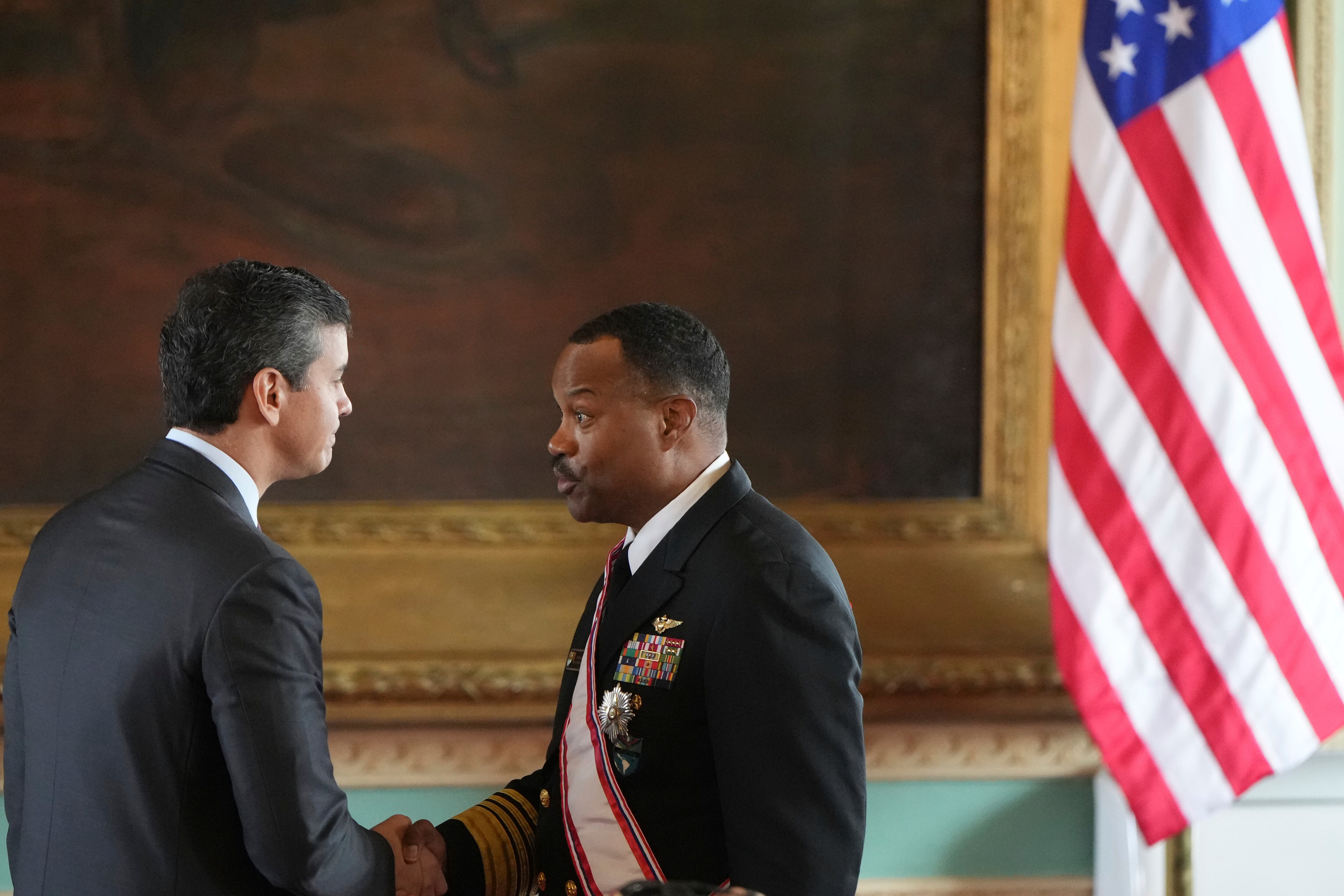 Paraguay's President Santiago Peña, left, shakes hands with Navy Adm. Alvin Holsey, commander of US Southern Command, who was awarded the Order of Merit “Gral Div Bernardino Caballero” in the grade of “Gran Cross”, at Government Palace in Asuncion, Paraguay, Saturday, Aug. 23, 2025. (AP Photo/Jorge Saenz)
