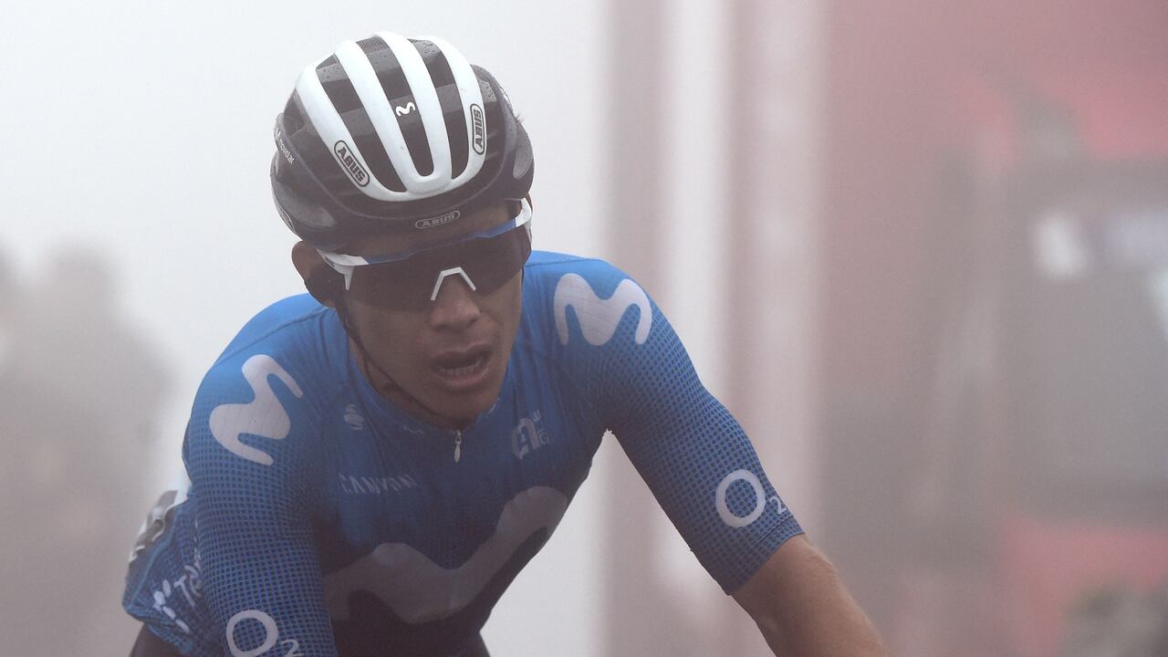 Team Movistar's Colombian rider Miguel Angel Lopez crosses the finish line in first place during the 18th stage of the 2021 La Vuelta cycling tour of Spain, a 162.6 km race from Salas to Altu d'El Gamoniteiru in Pola de Lena, on September 2, 2021. (Photo by MIGUEL RIOPA / AFP)