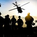 Silhouettes of soldiers during Military Mission at dusk