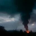 This grab taken from video distributed by Siranush Sargsyan's Twitter account on Monday, Sept. 25, 2023, shows smoke rising after a fuel depot explosion near Stepanakert, Nagorno-Karabakh. Several dozen people were injured on Monday night at a gas station just outside of the breakaway region's capital, Stepanakert, where a fuel tank exploded. Dozens of people were lining up at the gas station at the time to fuel their cars in order to move to Armenia. (Siranush Sargsyan's Twitter account via AP)