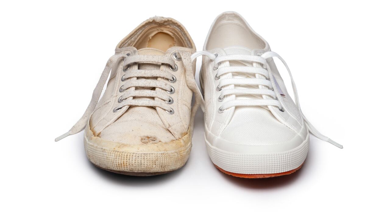 Close-up of an old and new canvas tennis shoe, isolated on white.