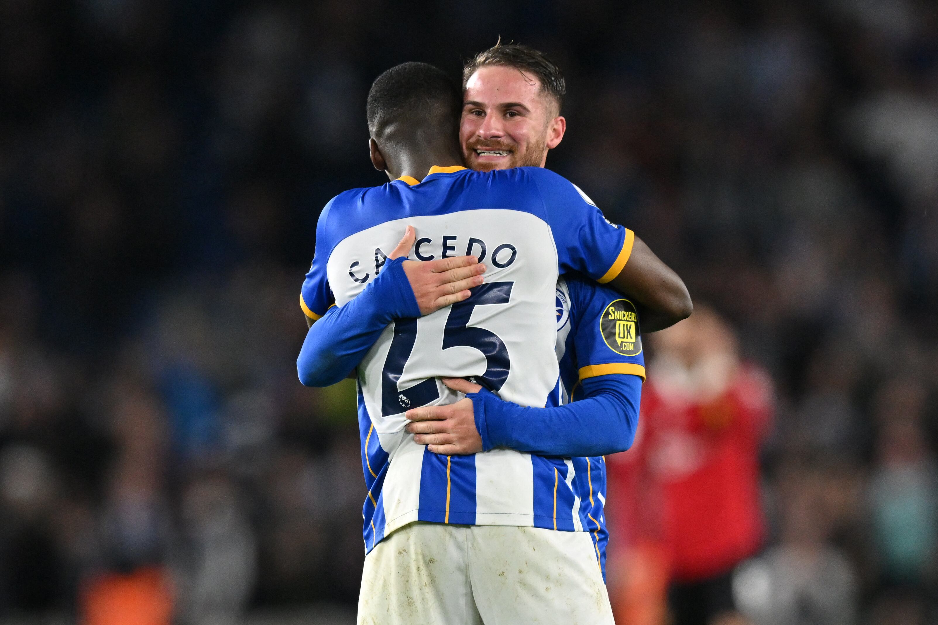 (FILES) Brighton's Argentinian midfielder Alexis Mac Allister (R) celebrates with Brighton's Ecuadorian midfielder Moises Caicedo (L) on the pitch after the English Premier League football match between Brighton and Hove Albion and Manchester United at the American Express Community Stadium in Brighton, southern England on May 4, 2023. Liverpool have agreed a British record transfer fee of �110 million ($140 million, 127 million euros) for Brighton midfielder Moises Caicedo, according to media reports on Friday August 11. (Photo by Glyn KIRK / AFP) / RESTRICTED TO EDITORIAL USE. No use with unauthorized audio, video, data, fixture lists, club/league logos or 'live' services. Online in-match use limited to 120 images. An additional 40 images may be used in extra time. No video emulation. Social media in-match use limited to 120 images. An additional 40 images may be used in extra time. No use in betting publications, games or single club/league/player publications. /