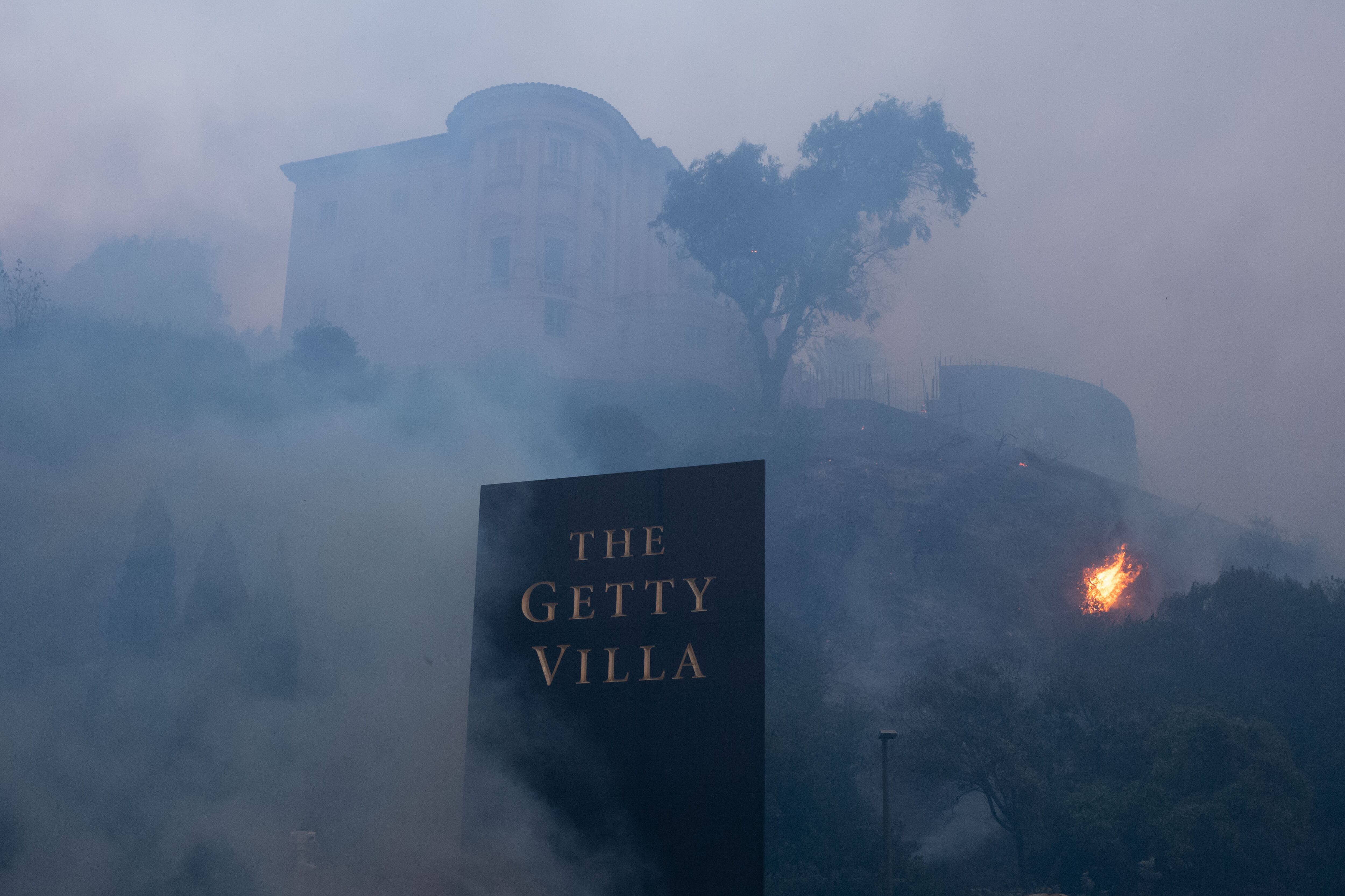 PACIFIC PALISADES, CA - JANUARY 07: Smoke and flames surround the Getty Museum along Pacific Coast Highway in the Palisades Fire on Tuesday, January 7, 2025 (Photo by David Crane/MediaNews Group/Los Angeles Daily News via Getty Images)