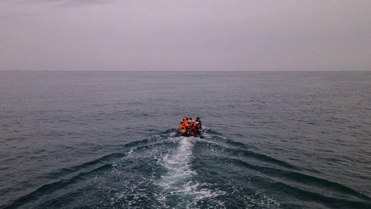 An aerial photo shows migrants in a dinghy wearing life jackets as they illegally cross the English Channel from France to Britain on September 11, 2020. - The number of migrants crossing the English Channel -- which is 33,8 km (21 miles) at the closest point in the Straits of Dover -- in small inflatable boats has spiralled over the summer of the 2020. According to authorities in northern France some 6,200 migrants have attempted the crossing between January 1 and August 31, 2020, compared with 2,294 migrants for the whole of 2019. (Photo by Sameer Al-DOUMY / AFP)