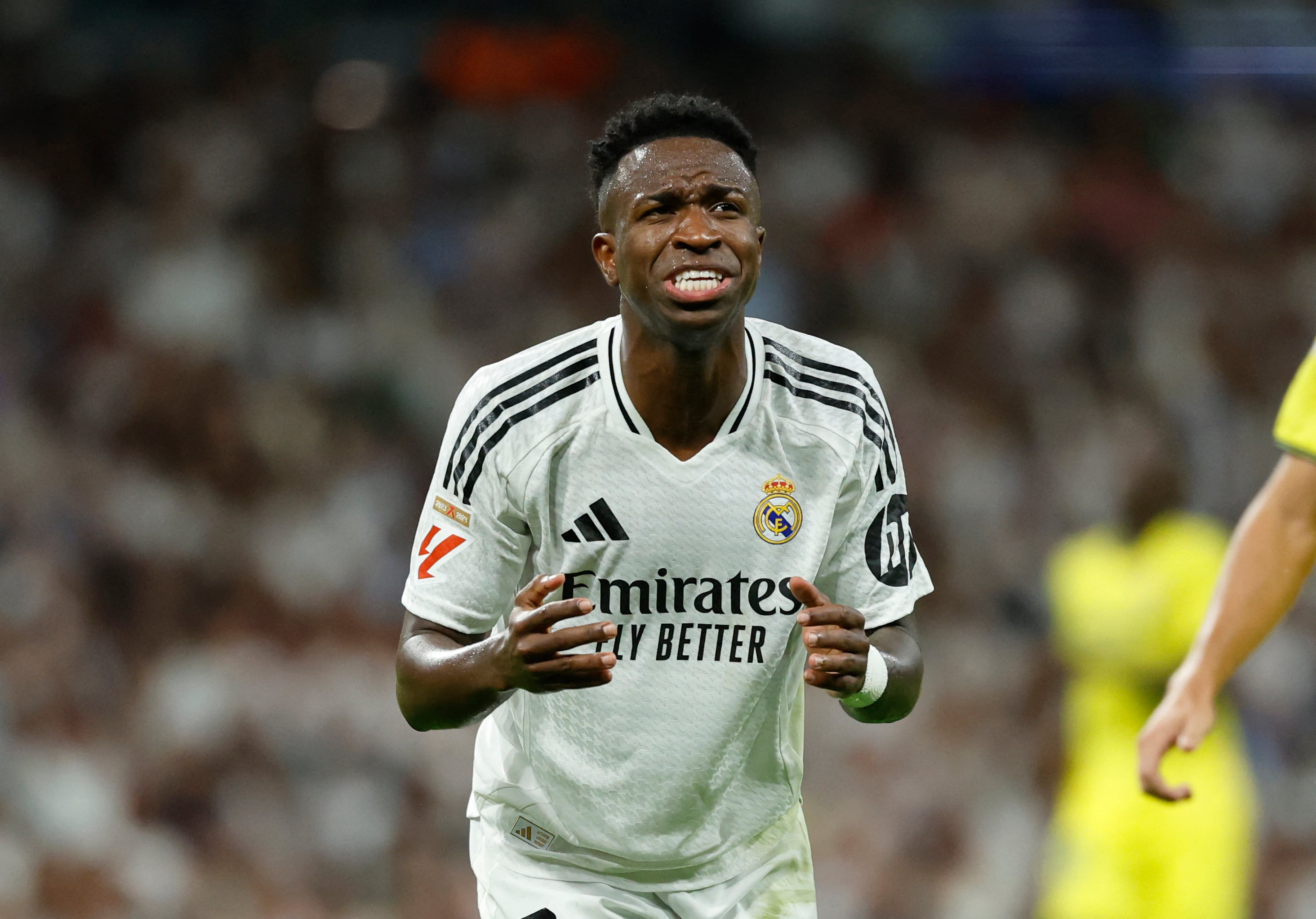 Real Madrid's Brazilian forward #07 Vinicius Junior reacts during the Spanish league football match between Real Madrid CF and Villarreal CF at the Santiago Bernabeu stadium in Madrid on October 5, 2024. (Photo by OSCAR DEL POZO / AFP)