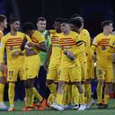 Barcelona players celebrate after the Spanish La Liga soccer match between Espanyol and Barcelona at the RCDE stadium in Barcelona, Sunday, May 14, 2023. (AP Photo/Joan Monfort)