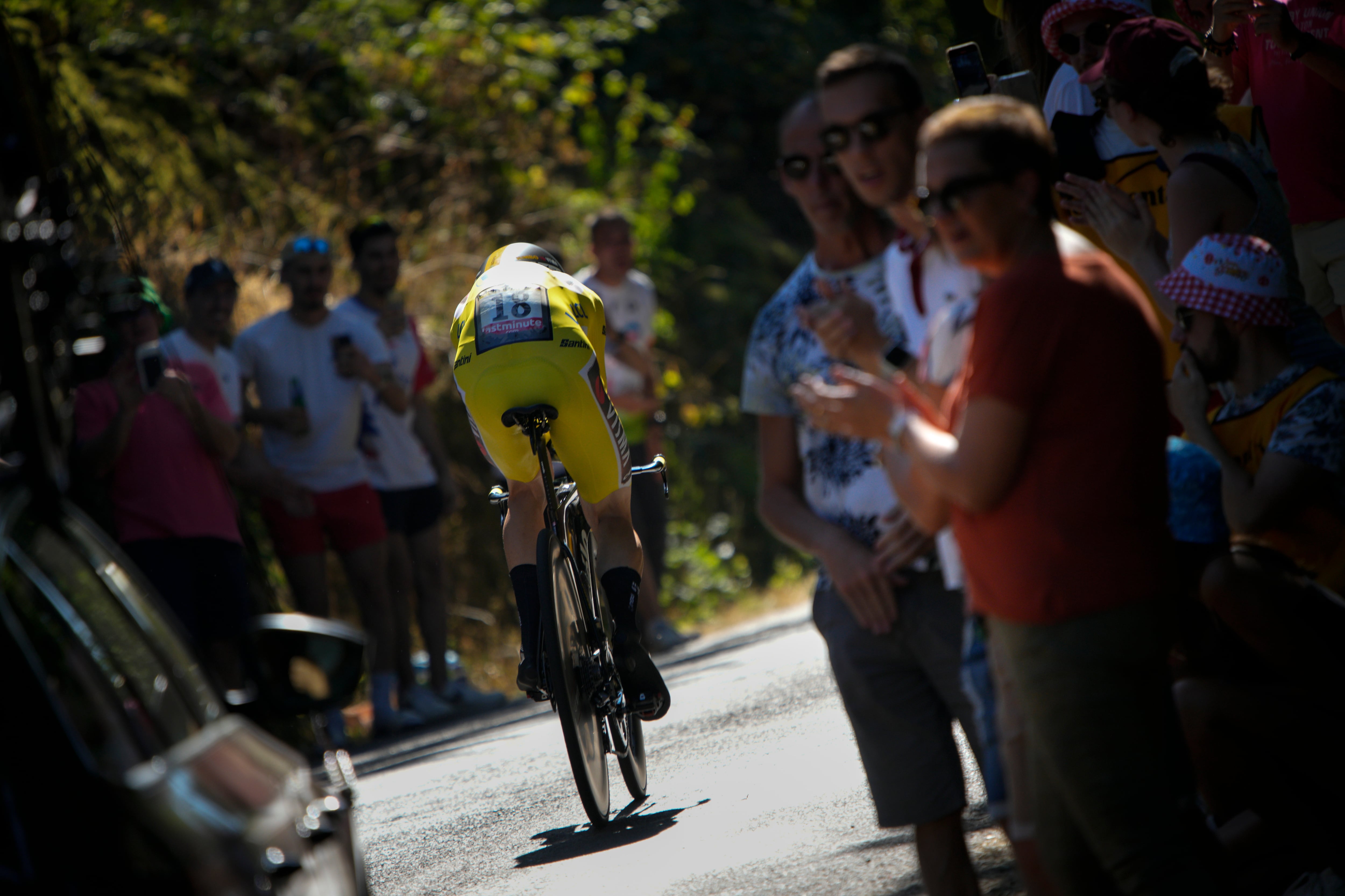 Denmark's Jonas Vingegaard, wearing the overall leader's yellow jersey, competes during the twentieth stage of the Tour de France cycling race, an individual time trial over 40.7 kilometers (25.3 miles) with start in Lacapelle-Marival and finish in Rocamadour, France, Saturday, July 23, 2022. (AP Photo/Daniel Cole)