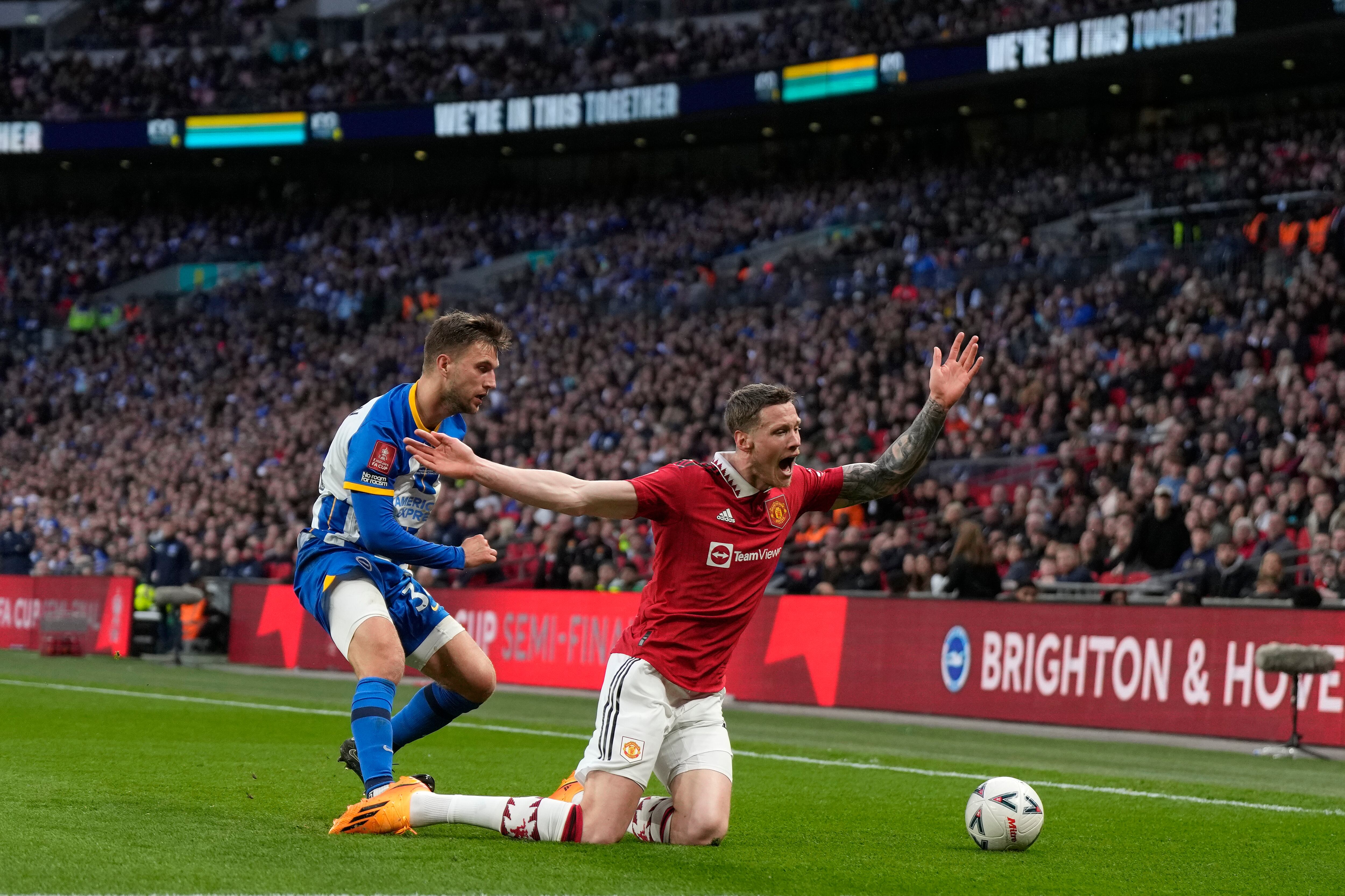 Manchester United's Wout Weghorst appeals for a foul after being pushed over during the English FA Cup semifinal soccer match between Brighton and Hove Albion and Manchester United at Wembley Stadium in London, Sunday, April 23, 2023. (AP Photo/Alastair Grant)