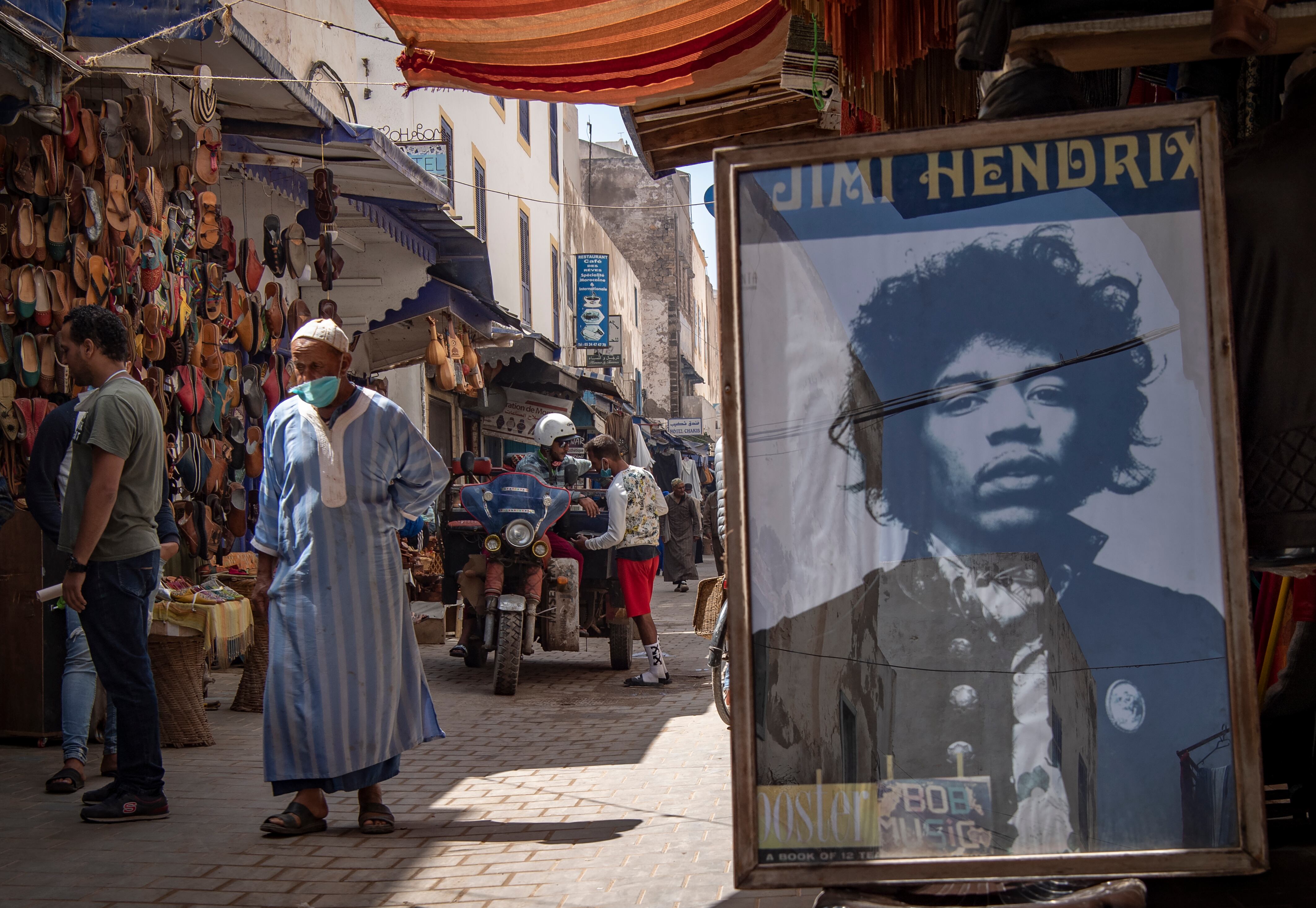 A picture taken in the Moroccan coastal city of Essaouira shows portraits of late US guitarist Jimi Hendrix on September 10, 2020. - Some claim to have seen him, others to have spoken with him -- 50 years after guitar legend Jimi Hendrix's untimely death, a village on Morocco's Atlantic coast pulsates with his memory. In the Summer of 1969, Hendrix, the pioneering US guitar wizard whose whose hits included "Purple Haze" and "Hey Joe", made a brief stop in Essaouira, a former fort town and latter day tourist magnet located five kilometres (three miles) from his childhood village. (Photo by FADEL SENNA / AFP)