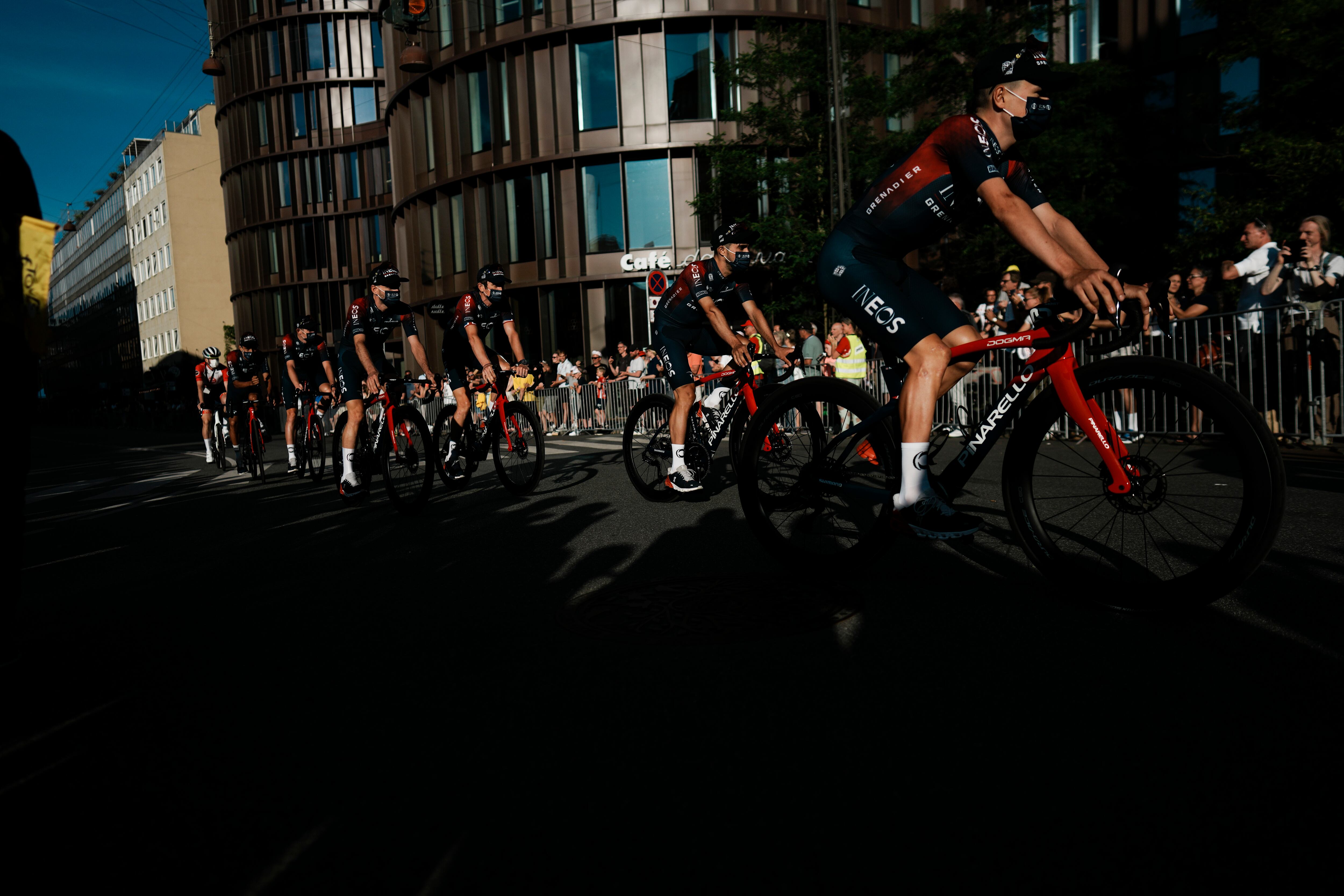 Team Ineos Grenadier riders pass during the team presentation ahead of the Tour de France cycling race in Copenhagen, Denmark, Wednesday, June 29, 2022. The race starts Friday, July 1, the first stage is an individual time trial over 13.2 kilometers (8.2 miles) with start and finish in Copenhagen. (AP Photo/Thibault Camus)