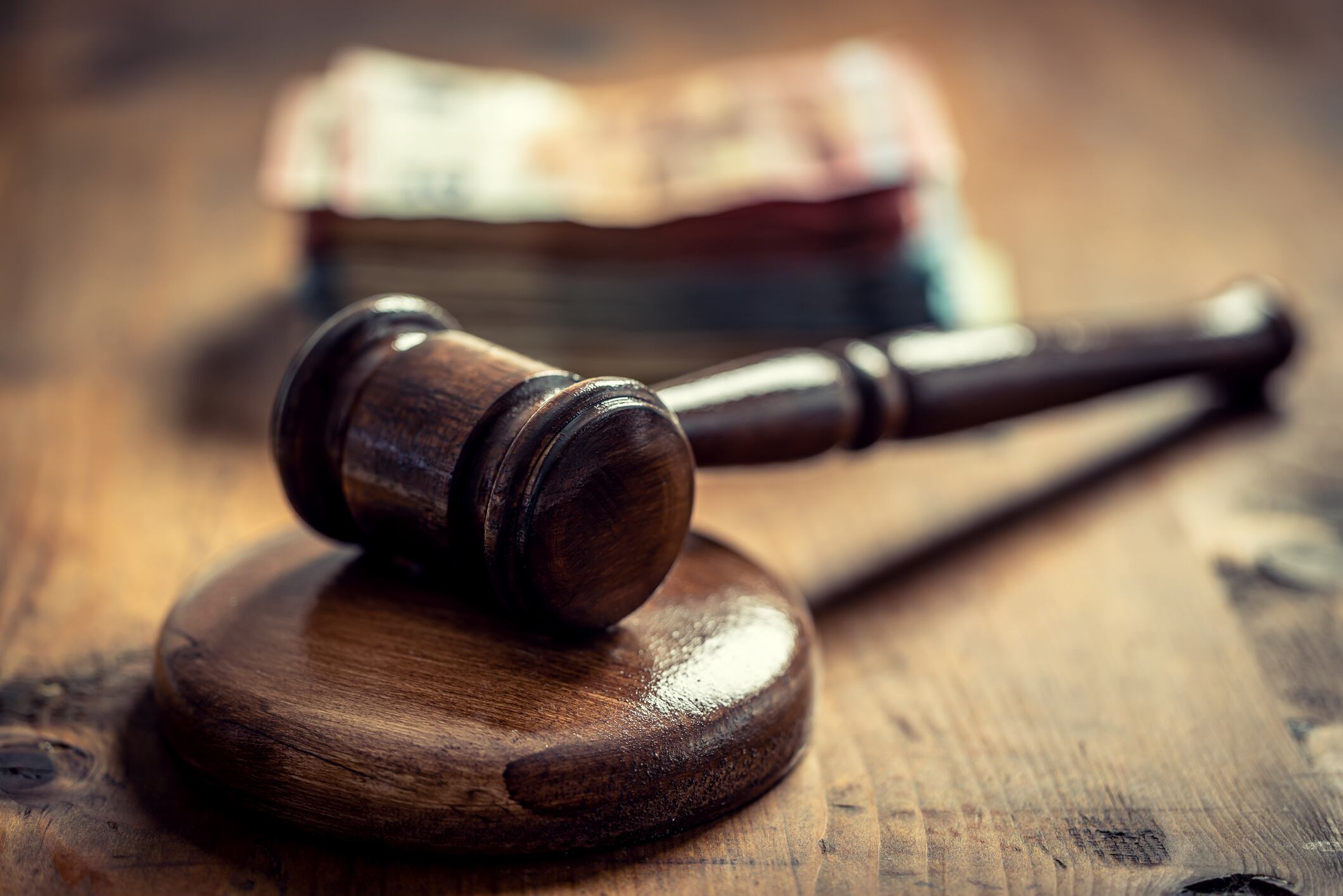 Corruption in the judiciary, the judge's gavel and euro banknotes in an envelope. Representation of corruption and bribery in the judiciary.