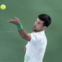 Serbia's Novak Djokovic serves to Czech Republic's Jiri Vesely during a match at the Dubai Duty Free Tennis Championship in Dubai, United Arab Emirates, Thursday, Feb. 24, 2022. (AP Photo/Ebrahim Noroozi)