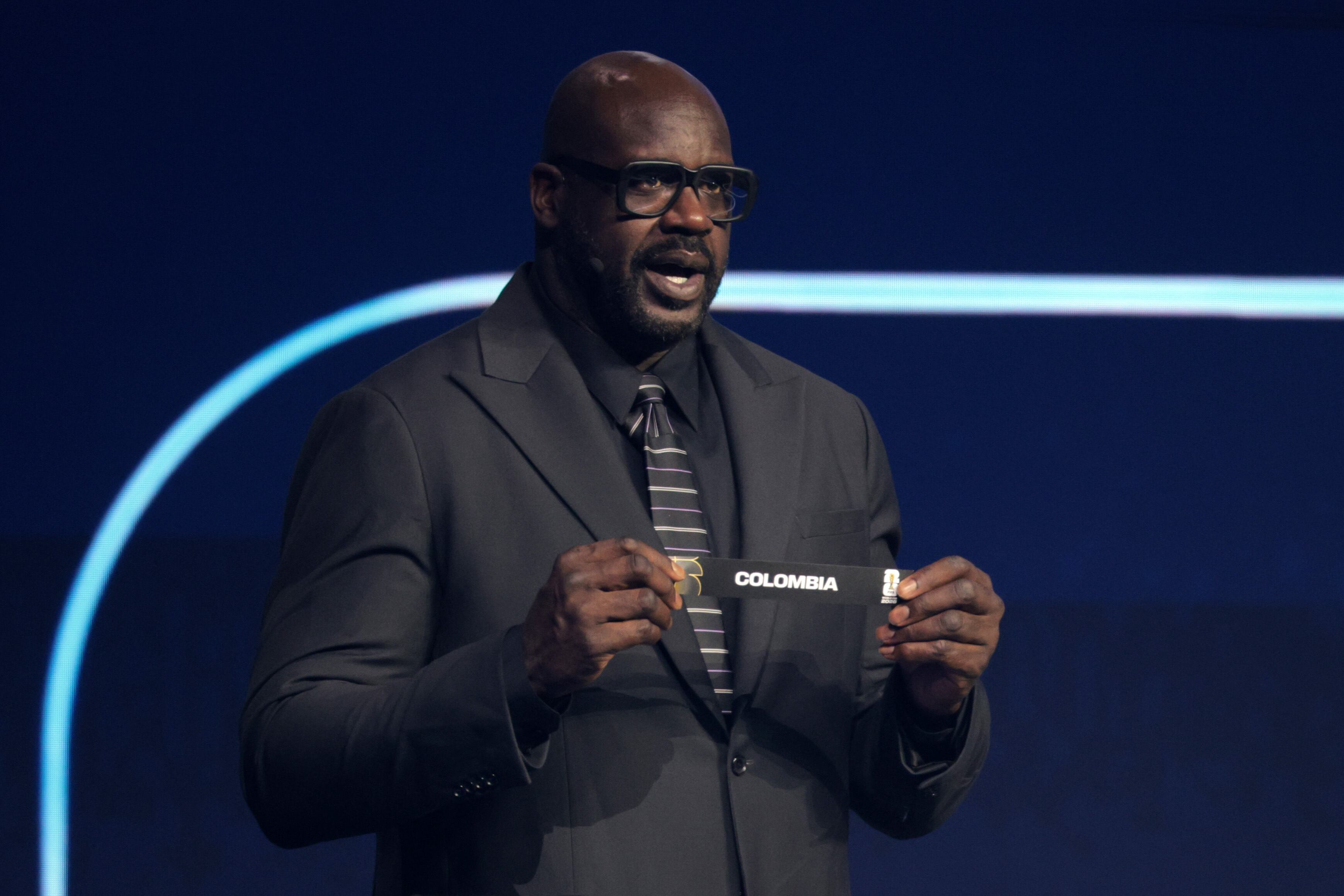 WASHINGTON, DC - DECEMBER 05: Draw assistant Shaquille O’Neal draws out the card of Colombia during the FIFA World Cup 2026 Official Draw at John F. Kennedy Center for the Performing Arts on December 05, 2025 in Washington, DC. (Photo by Kevin Dietsch/Getty Images)
