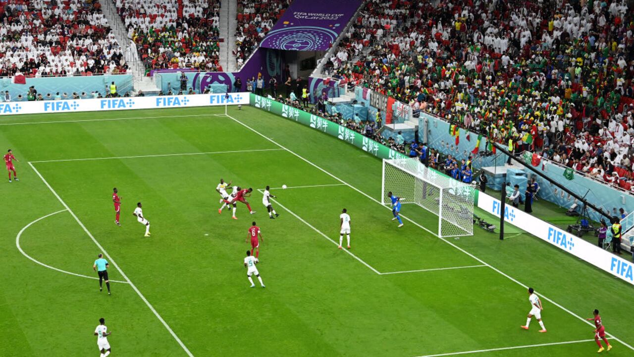 DOHA, QATAR - NOVEMBER 25: Mohammed Muntari of Qatar heads to score their team's first goal during the FIFA World Cup Qatar 2022 Group A match between Qatar and Senegal at Al Thumama Stadium on November 25, 2022 in Doha, Qatar. (Photo by Dan Mullan/Getty Images)