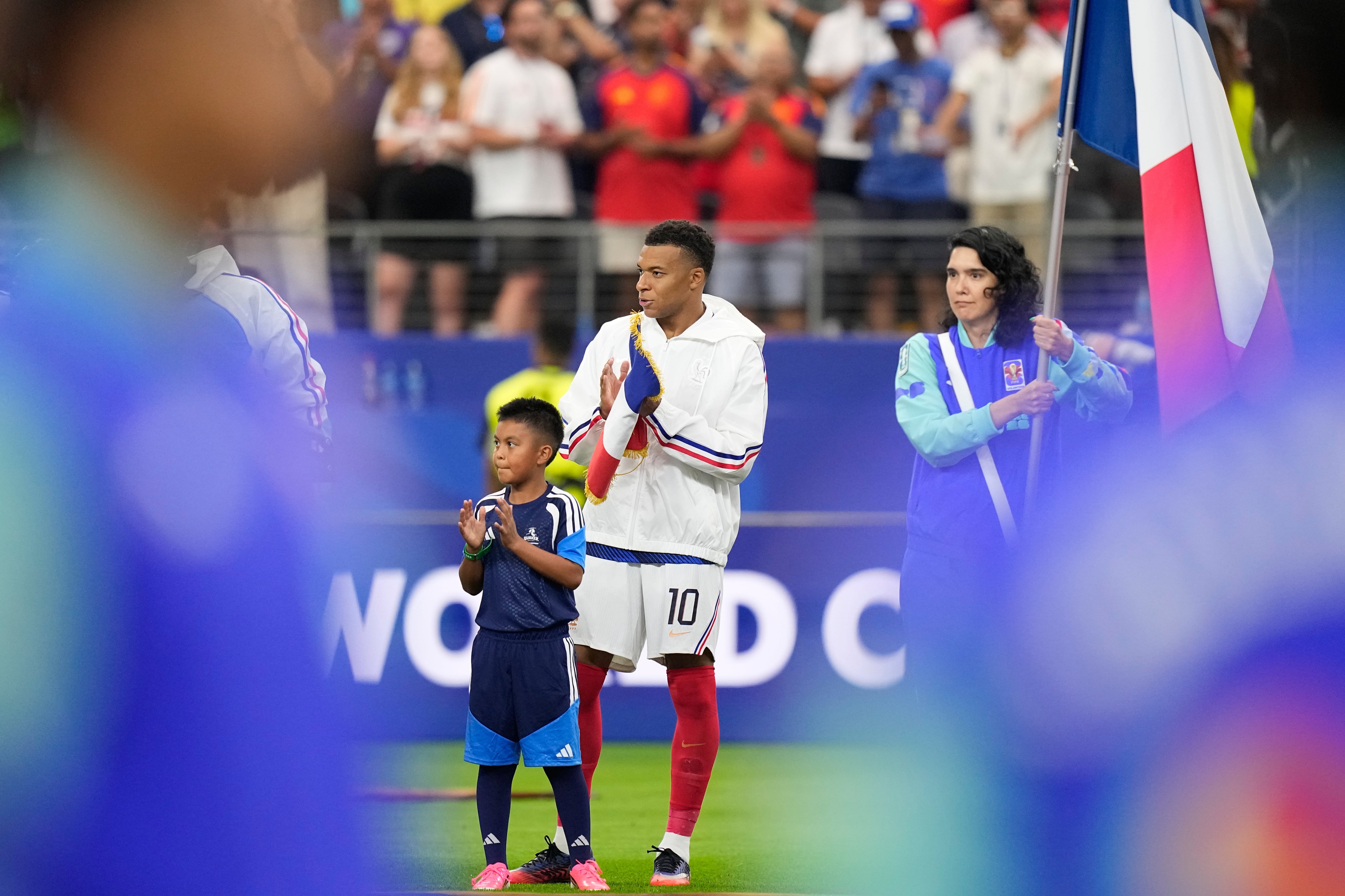 France's Kylian Mbappe applauds before the World Cup semifinal soccer match between France and Spain in Arlington, Texas, near Dallas, Monday, July 14, 2026. (AP Photo/Ashley Landis)