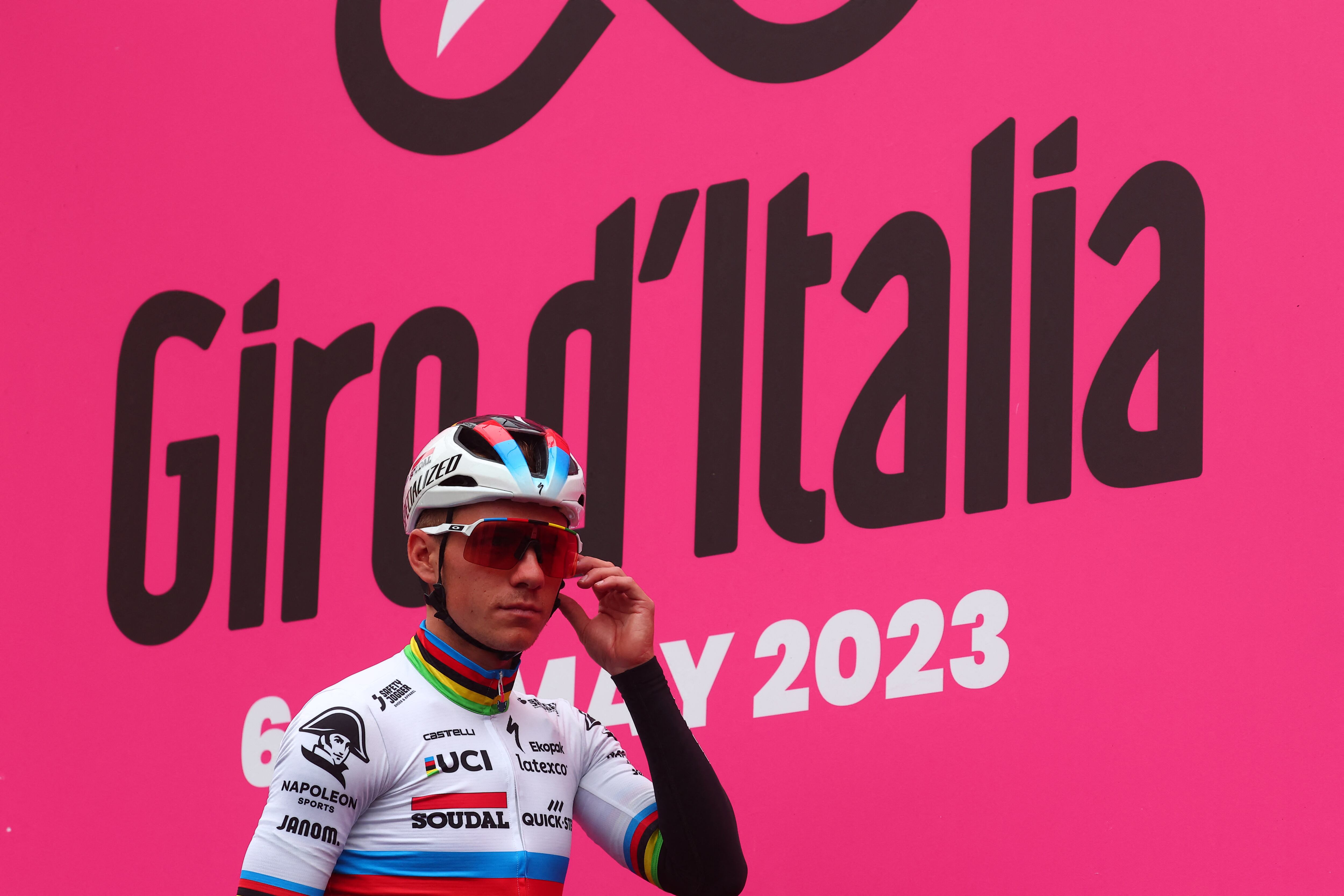 Soudal - Quick Step's Belgian rider Remco Evenepoel stands on the podium during the presentation of the teams, prior to the eighth stage of the Giro d'Italia 2023 cycling race, 207 km between Terni and Fossombrone, on May 13, 2023. (Photo by Luca Bettini / AFP)