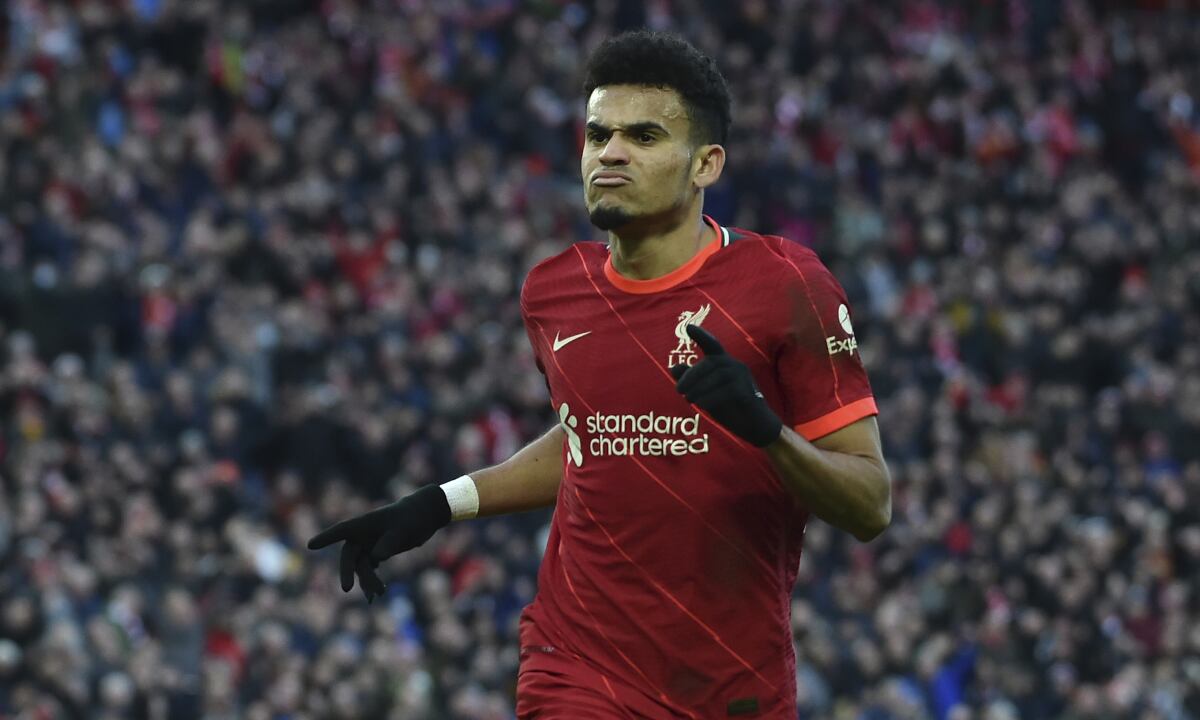 Liverpool's Luis Diaz celebrates after scoring his sides 3rd goal during the English Premier League soccer match between Liverpool and Norwich City and at Anfield stadium in Liverpool, England, Saturday, Feb. 19, 2022. (AP/Rui Vieira)