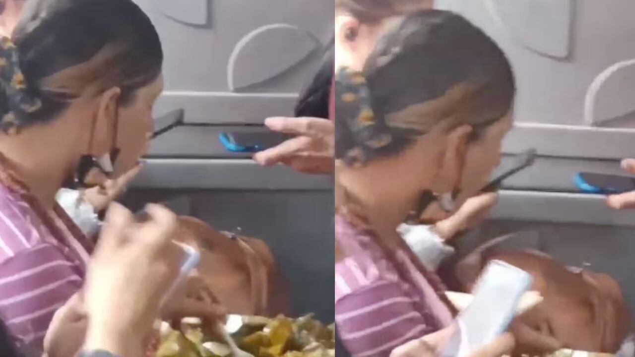 Graban a una mujer comiendo tamal en Transmilenio.