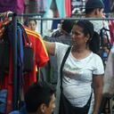 The serious economic situation, hyperinflation, falling purchasing power and high prices, force Venezuelans to go to the "garage sales" in warehouses and streets in the city of Maracaibo, Venezuela, on 15 December 2018. The traditional buying new clothes and shoes for the first time on Christmas and New Year's Eve, it is an unattainable dream for the inhabitants of this country whose inflation is boosted per hour, 3% every day. And the only immediate option to save money from the budget family is buying used clothes. The majority of the people who sell the clothes are by necessity to eat and another important group that leaves the country, and requires to leave those clothes and have the money to migrate. (Photo by Humberto Matheus/NurPhoto via Getty Images)