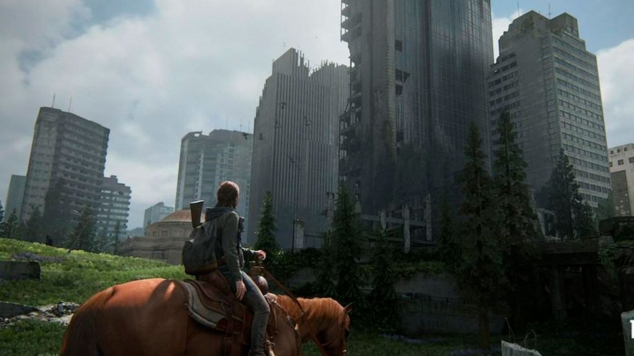 Escena de una ciudad destruida en el juego The Last of Us Part II.