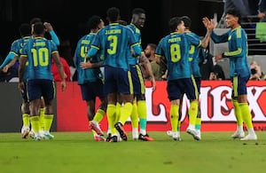 Colombia's Richard Rios, right, celebrates with teammates after assisting Luis Suarez to score their side's opening goal during the first half of an international friendly soccer match against Mexico, Saturday, Sept. 26, 2026, in Baltimore. (AP Photo/Stephanie Scarbrough)