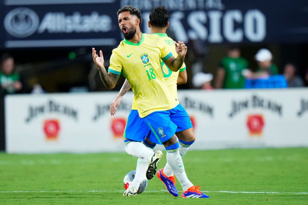 ORLANDO, FLORIDA - JUNE 12: Douglas Luiz #18 of Brazil reacts against the United States during the Continental Clasico 2024 game at Camping World Stadium on June 12, 2024 in Orlando, Florida.  (Photo by Rich Storry/Getty Images)